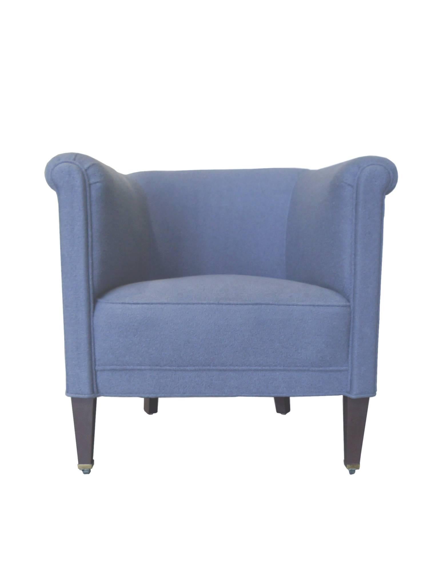 These 1930s Art Deco club chairs are newly reupholstered in a chalk-blue cotton bouclé. They have a beautiful barrel shape that culminates in a scrolling top. The fine reupholstery work includes piping that nicely contours the roundedness of the