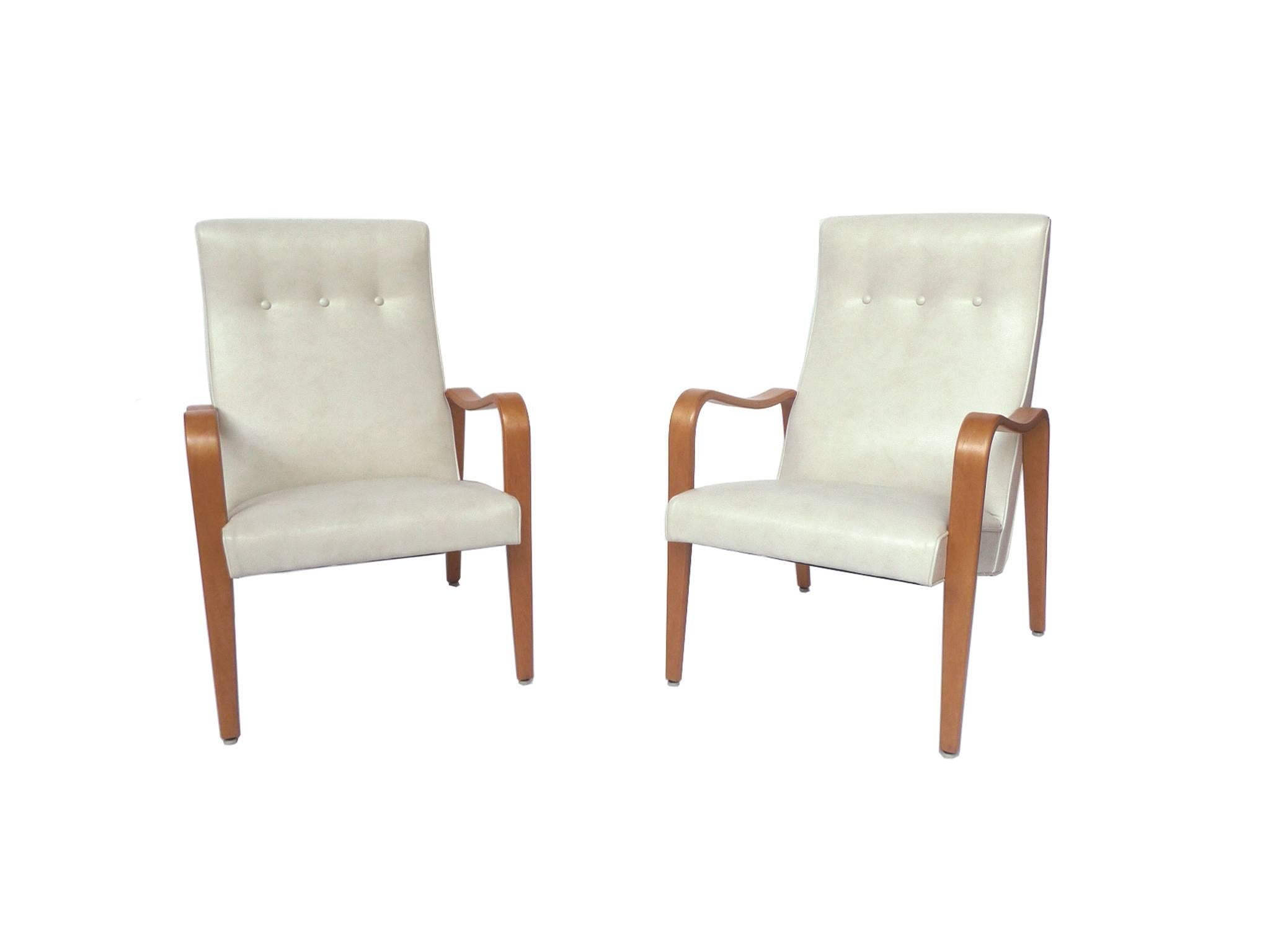 These Thonet lounge chairs are perfect for relaxing. They are very comfortable and beautifully designed, composed of bentwood and new upholstery work. The fabric is a white marine vinyl with piping made from the same material. Thonet was renowned
