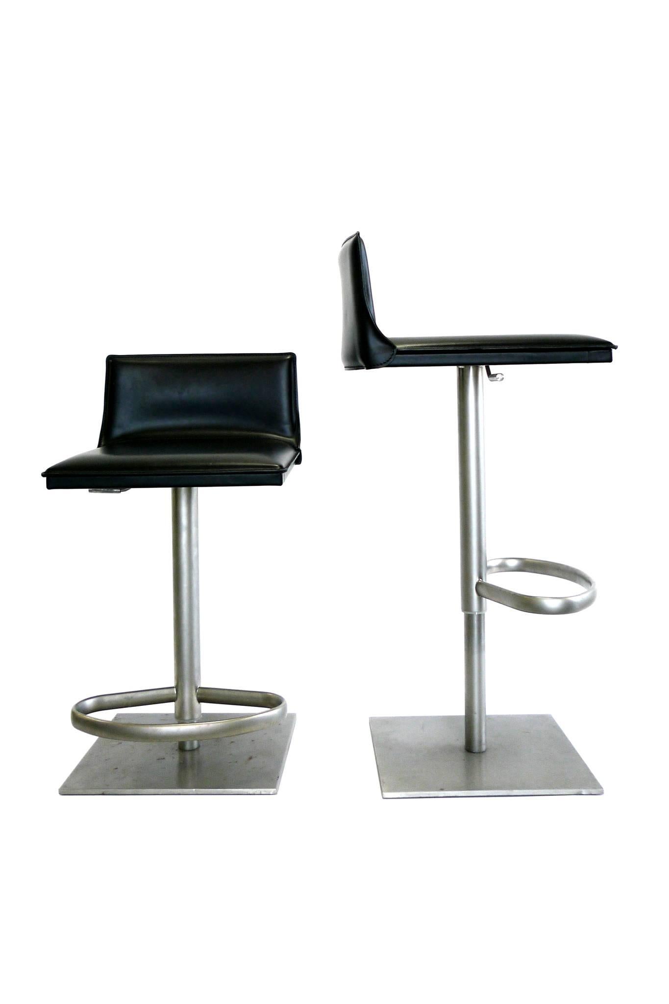 This handsome bar stool is manufactured by Frag. It consists of a well-padded leather seat and steel frame and leg. The chair's height is adjustable, allowing it to fit at a variety of levels. Other dynamic design features include a sturdy base, a
