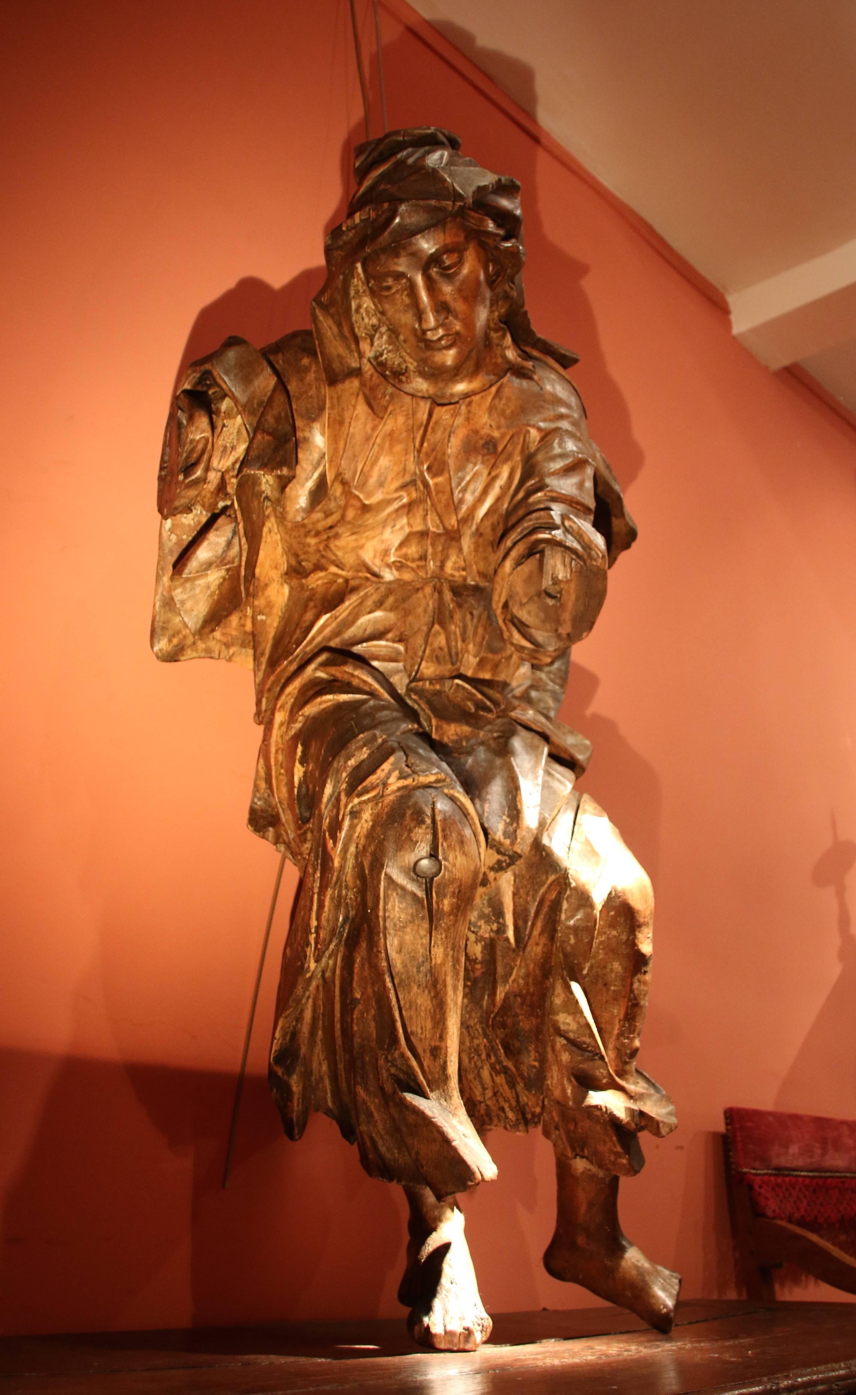 Origin: Southern Germany
Period: Late 15th – early 16th century
Limewood

This fine sculpture, whose folds and drapery’s work is quite remarkable playing with light and matter, may have been part of the ornamentation of a monumental organ-case.