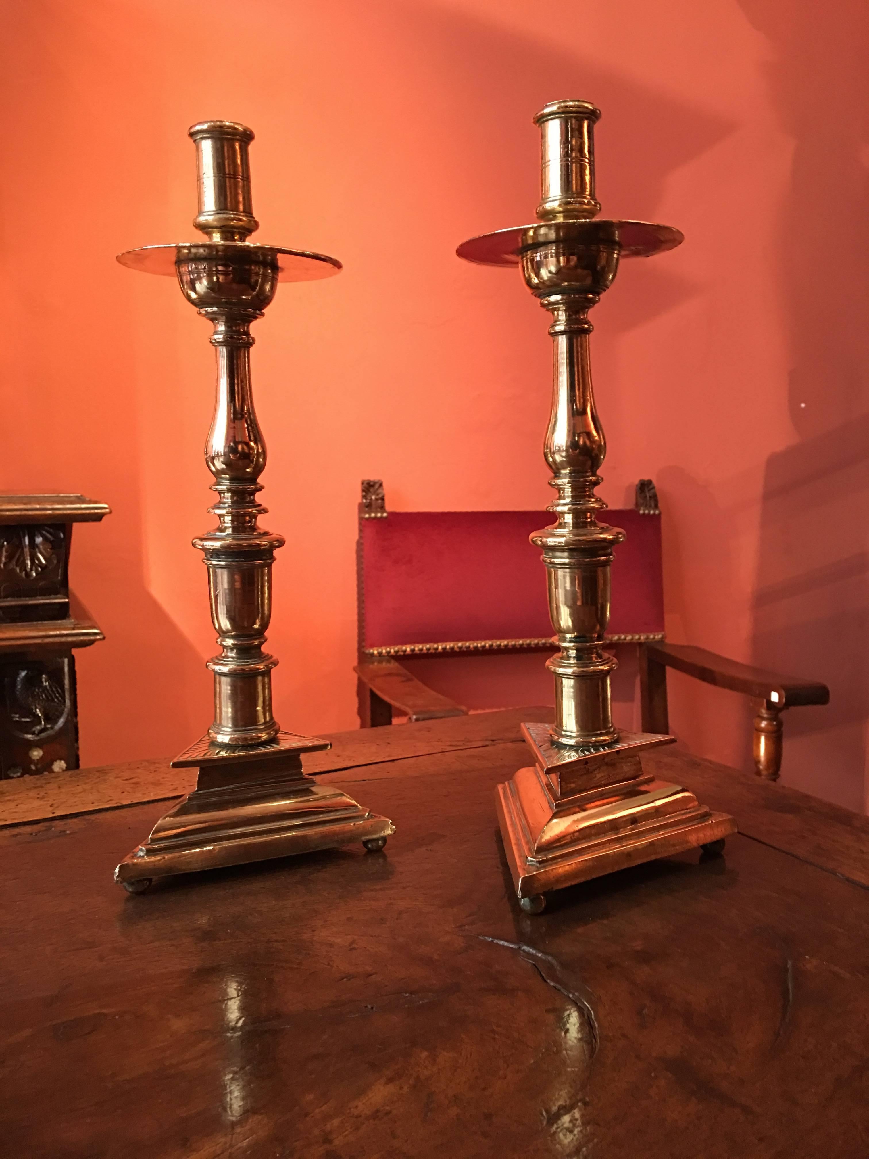 Pair of gilt bronze tripod candlesticks 

Origin: France
Period: 16th century 

Measures: Height 37 cm

Gilt bronze

Topped by the socket and cylinder the baluster foot stands upon a moulded tripod base.