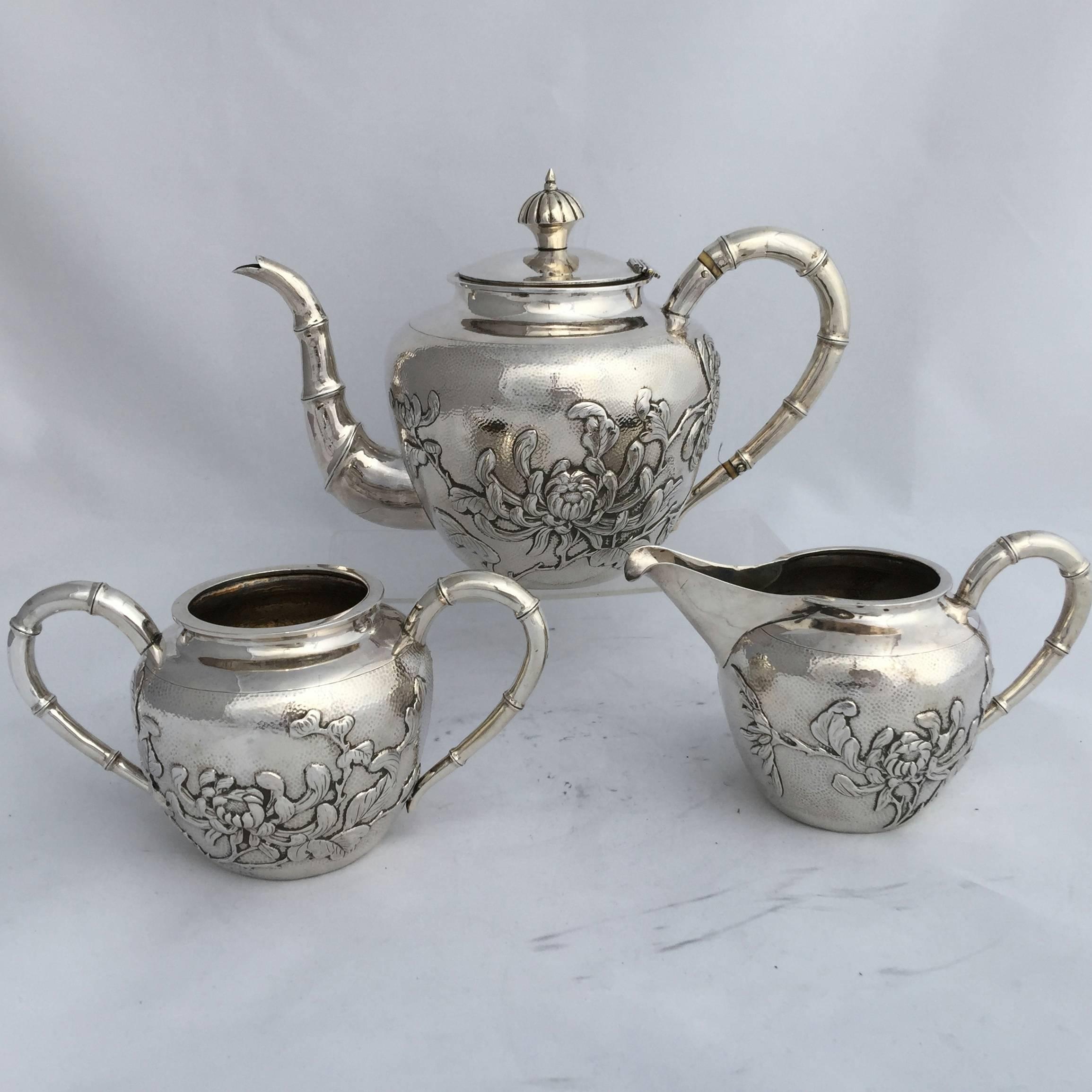 Repoussé Chinese Export Silver Three-Piece Tea Set with Chrysanthemum Detail Dating For Sale