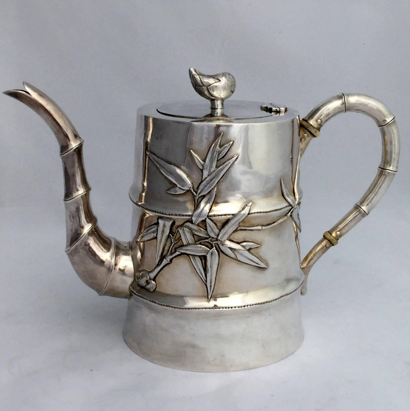 A four-piece Chinese export silver (CES) tea set using the bamboo motif. Each piece is in the form of a portion of the trunk of the bamboo - a style popular in the Art Deco period of the early 20th century. Finely repousse worked bamboo leaves