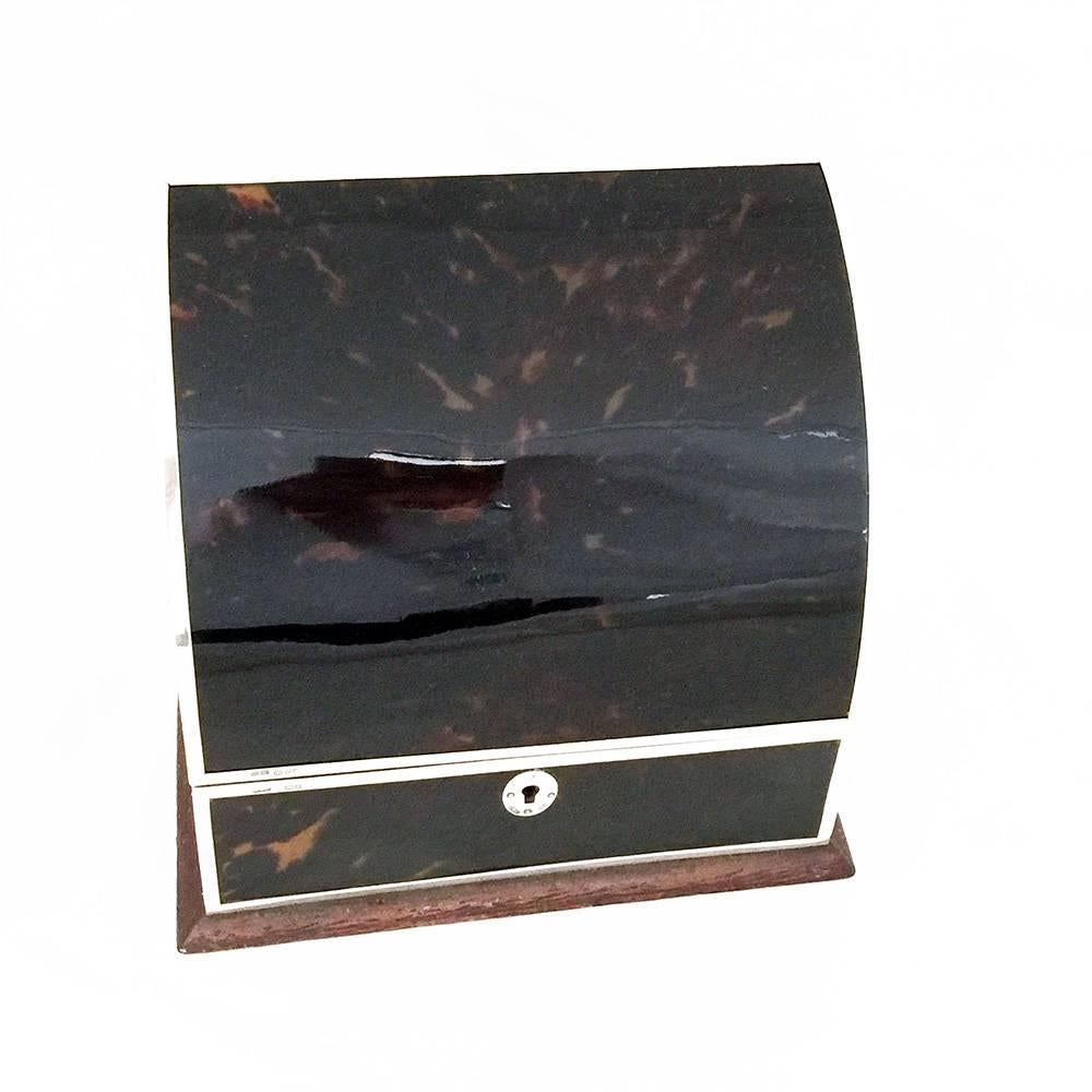 From a different era. A tortoiseshell letterbox with hall marked silver strapping.

There are four layers of grosgrain lined spaces for letters.

The ultimate addition to a desk.


