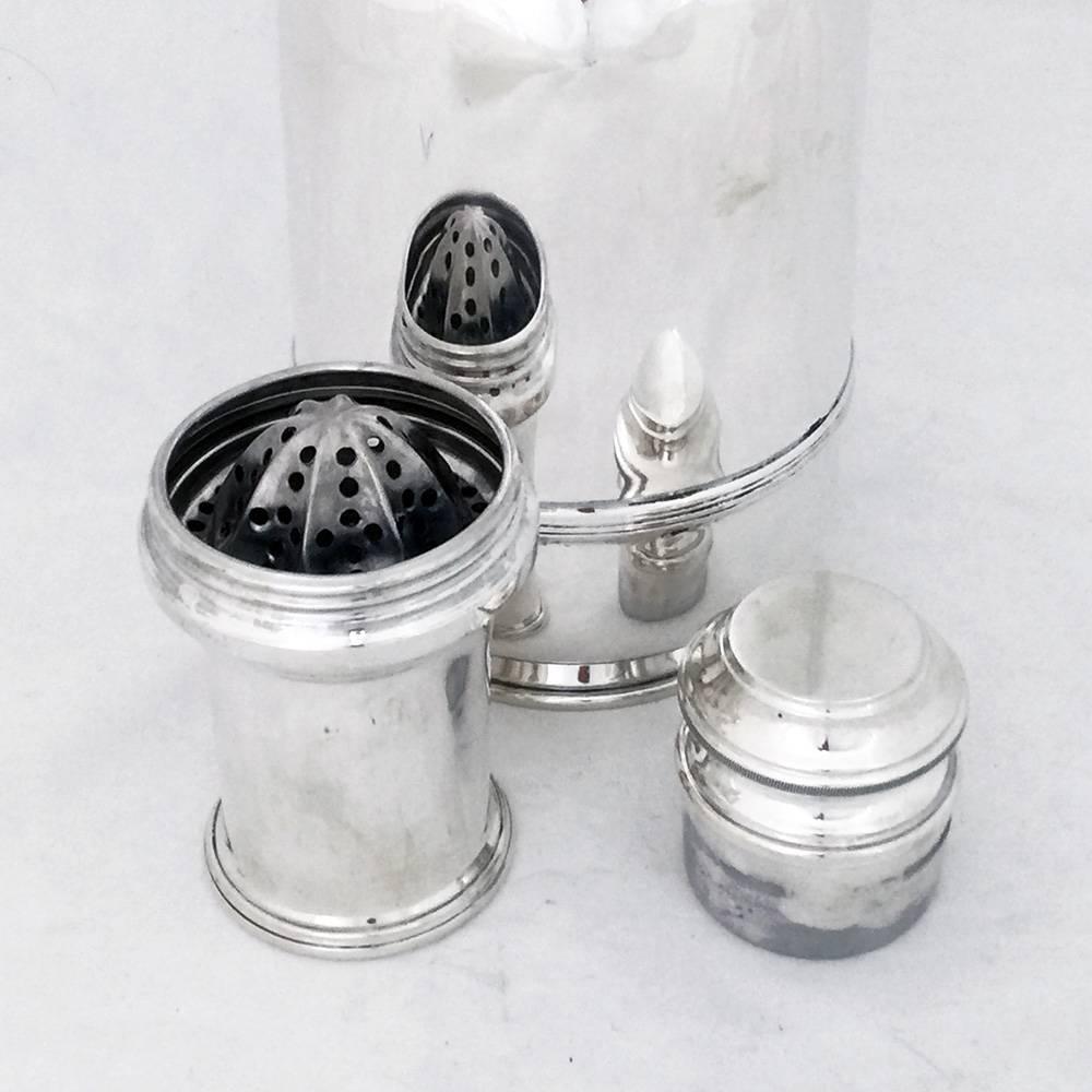 A fine sterling silver cocktail Shaker by the famous French firm, Cartier.

A complete shaker- this set even includes a lemon squeezer - most unusual and the top is the measure.

Fine condition and weight (725 grams).