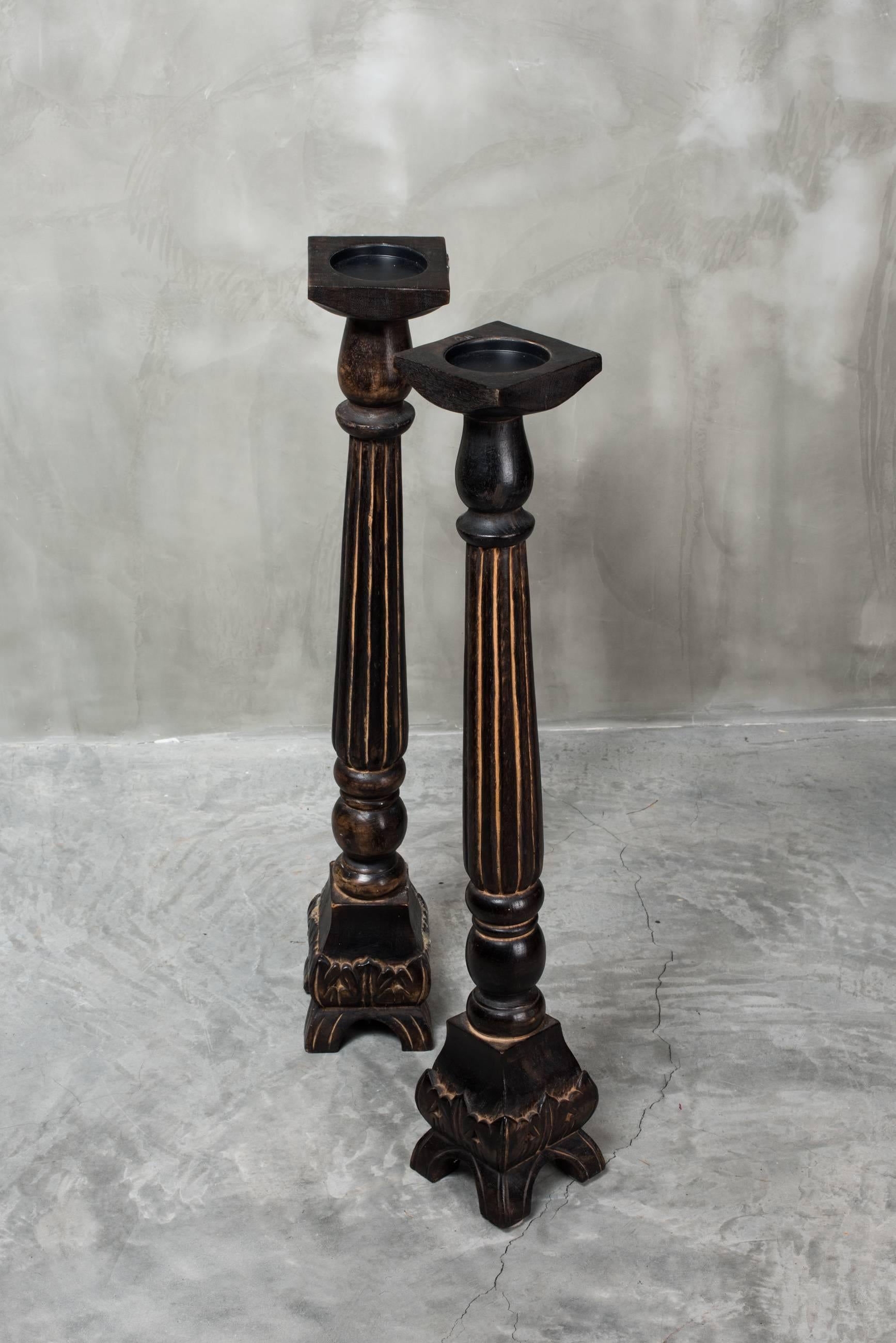 A pair of large carved ebonised wood ecclesiastic/church style candlesticks. These are tall enough to sit on the floor or on top of a table or large mantelpiece. As they are handmade and possibly came from a much larger amount, these two are not