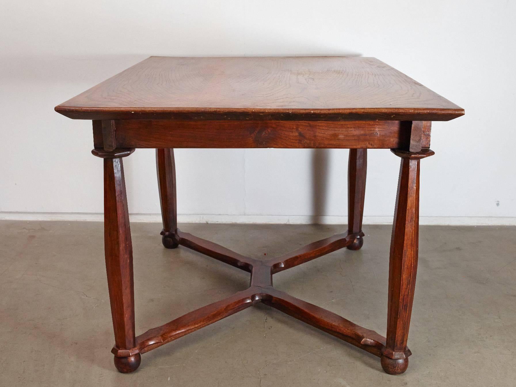 This rustic oak table was once the hall table to an English Chief Justice, according to the previous owner who found it in his Estate. It came from the Arts & Crafts era with elegant wood-turning work and stretchers joining each ball foot,
