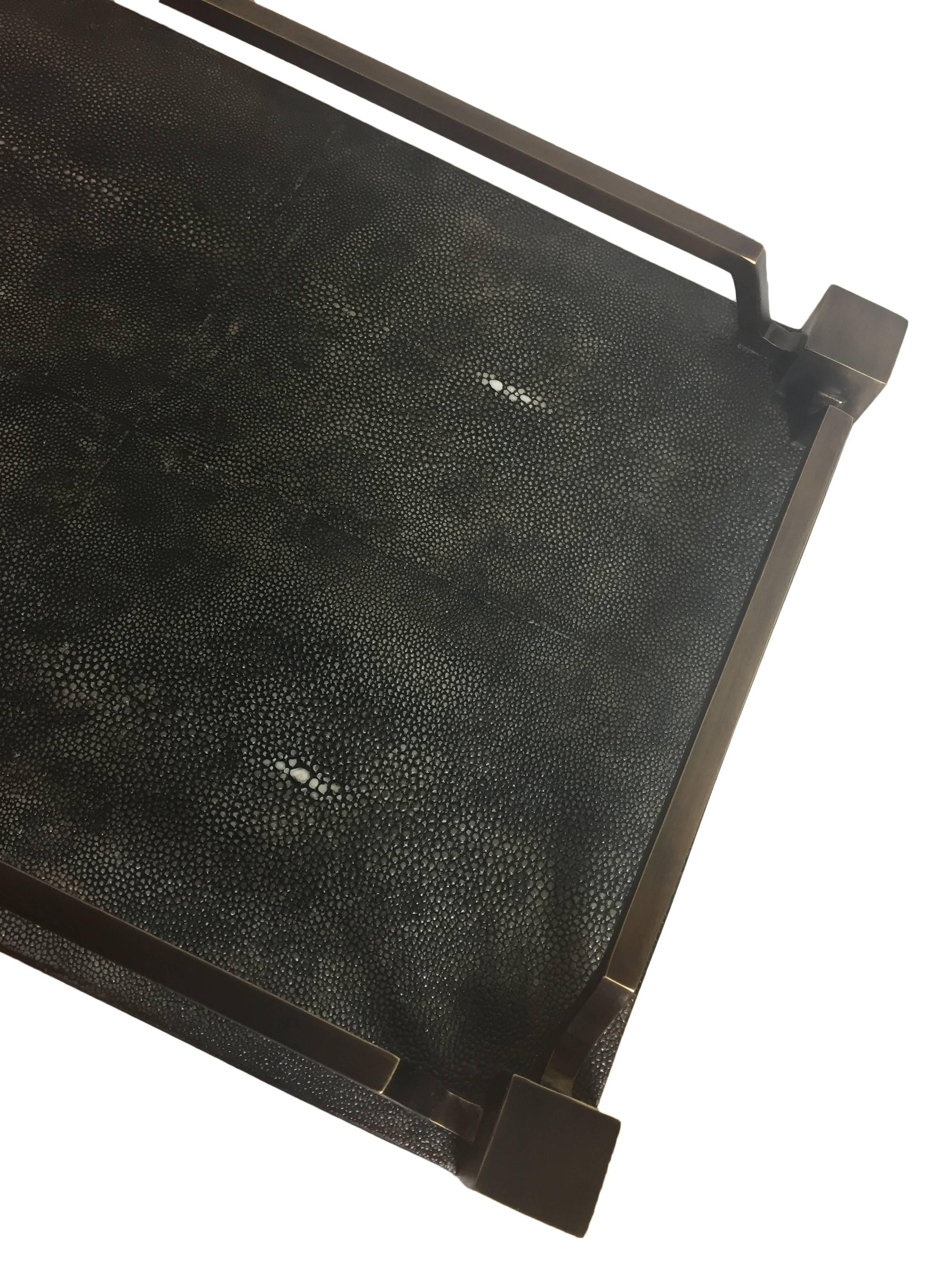 R & Y Augousti new shagreen service tray come in a dark shade with brass inlay. This gem was handmade over a period three months.