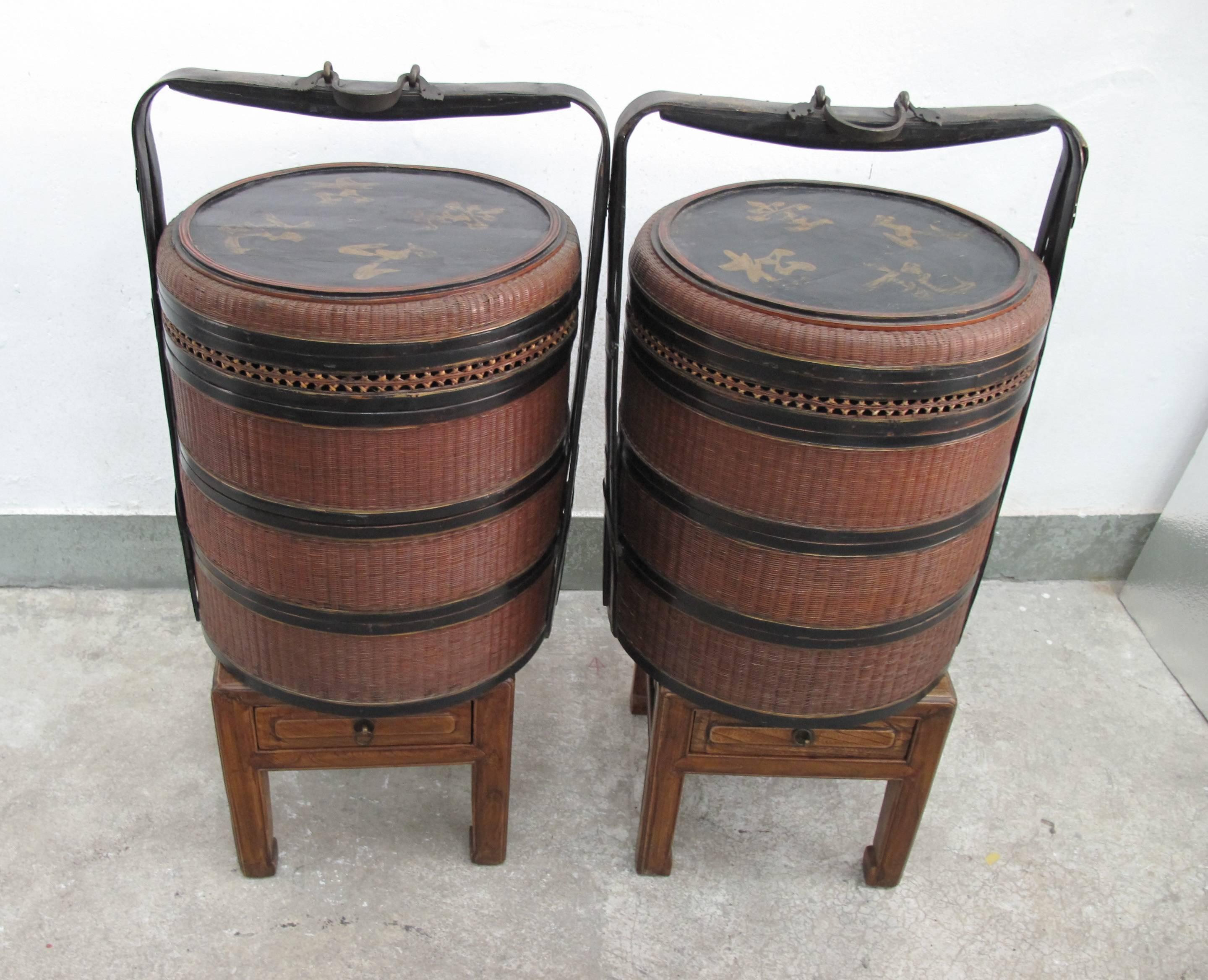 A pair of round silk bamboo woven wedding food basket with three tiers, a lid and black lacquer handle and metal holder, early 19th century. Chengzhou, Zhejiang Province.