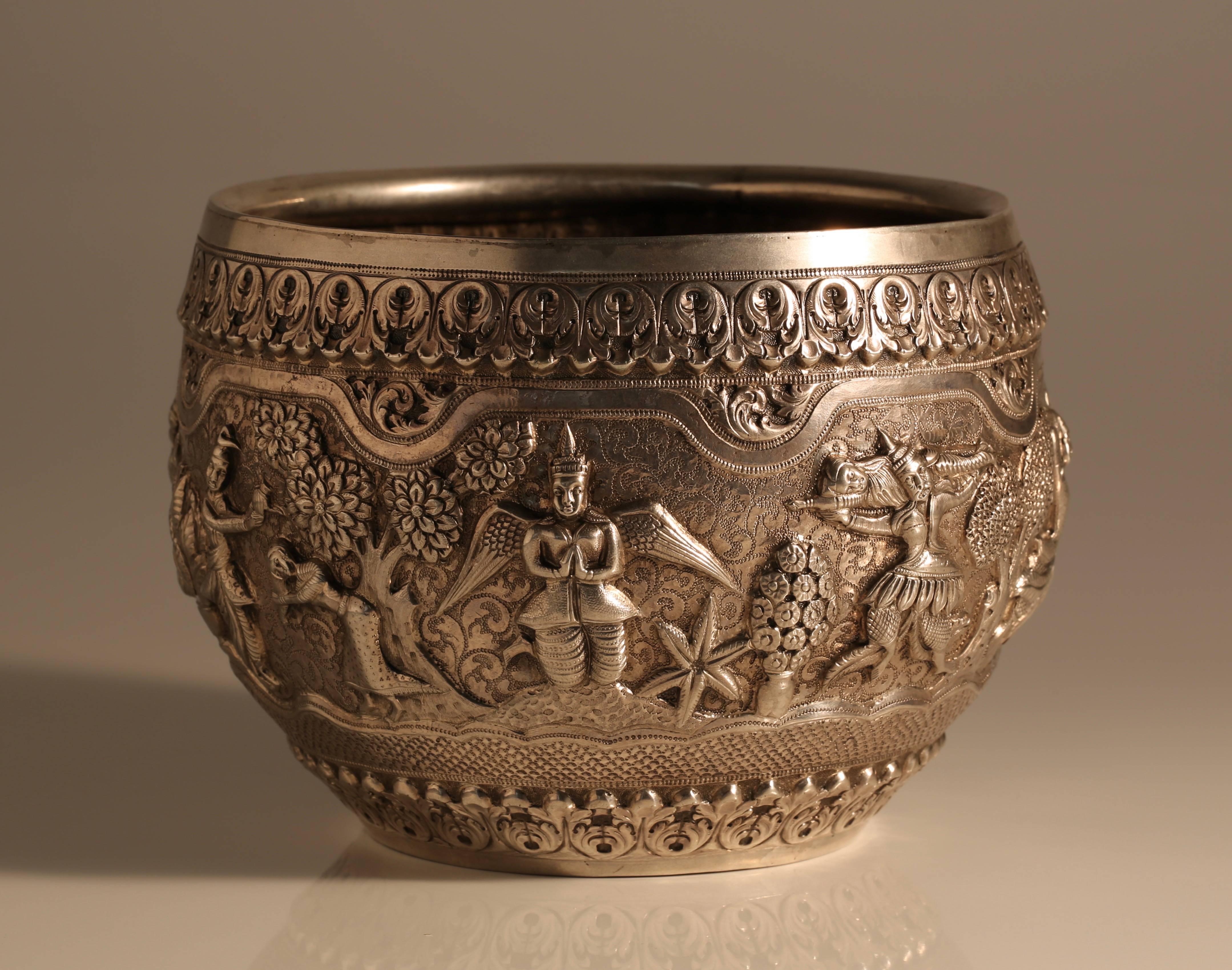 A good quality early 20th century Burmese silver bowl, heavily decorated with a typical combination of repouse and engraved decoration. A good size, suitable as a small jardiniere for an orchid or something similar, 
circa 1910.