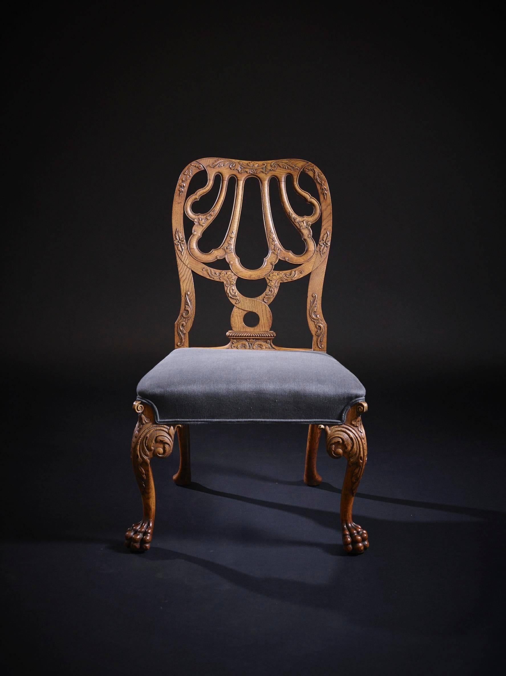 A good quality 19th century George II style English carved and joined oak side chair, after a design attributed to Giles Grendy (1693-1780). The original design for this chair circa 1745 and more commonly found in walnut. While not a period chair,