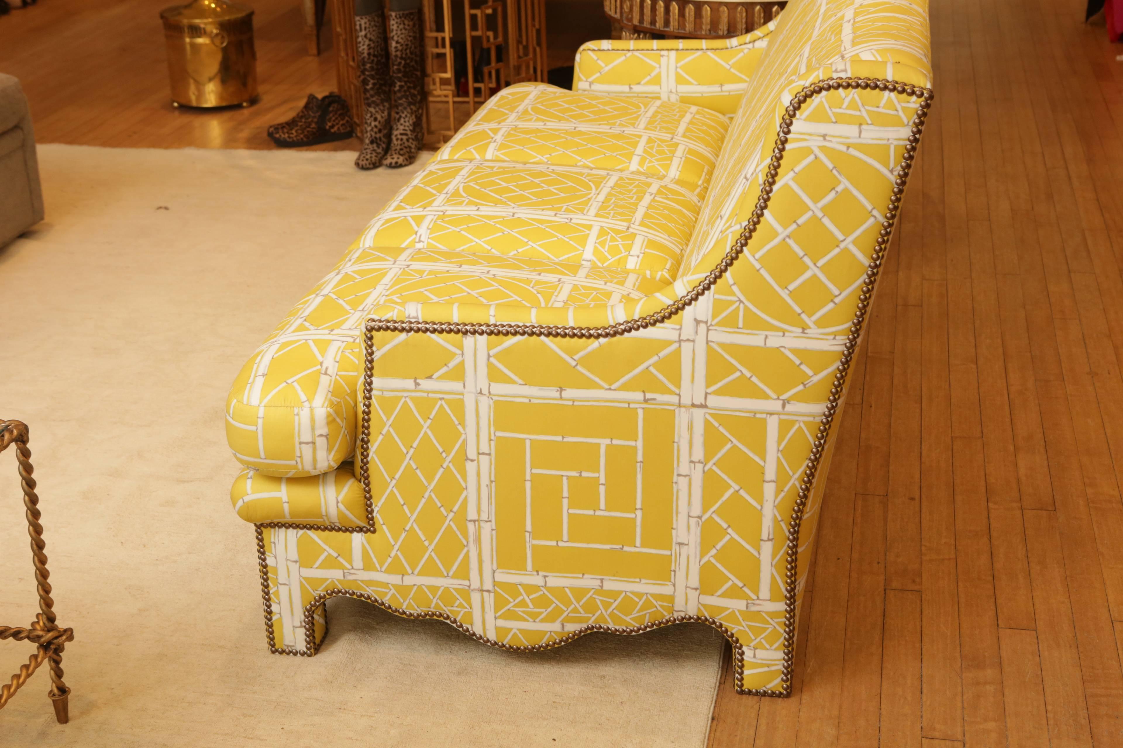 An original Bunny Williams sofa from 2005, upholstered in Bunny Williams fabric. Finished with brass rivets.

Original retail: $7250.