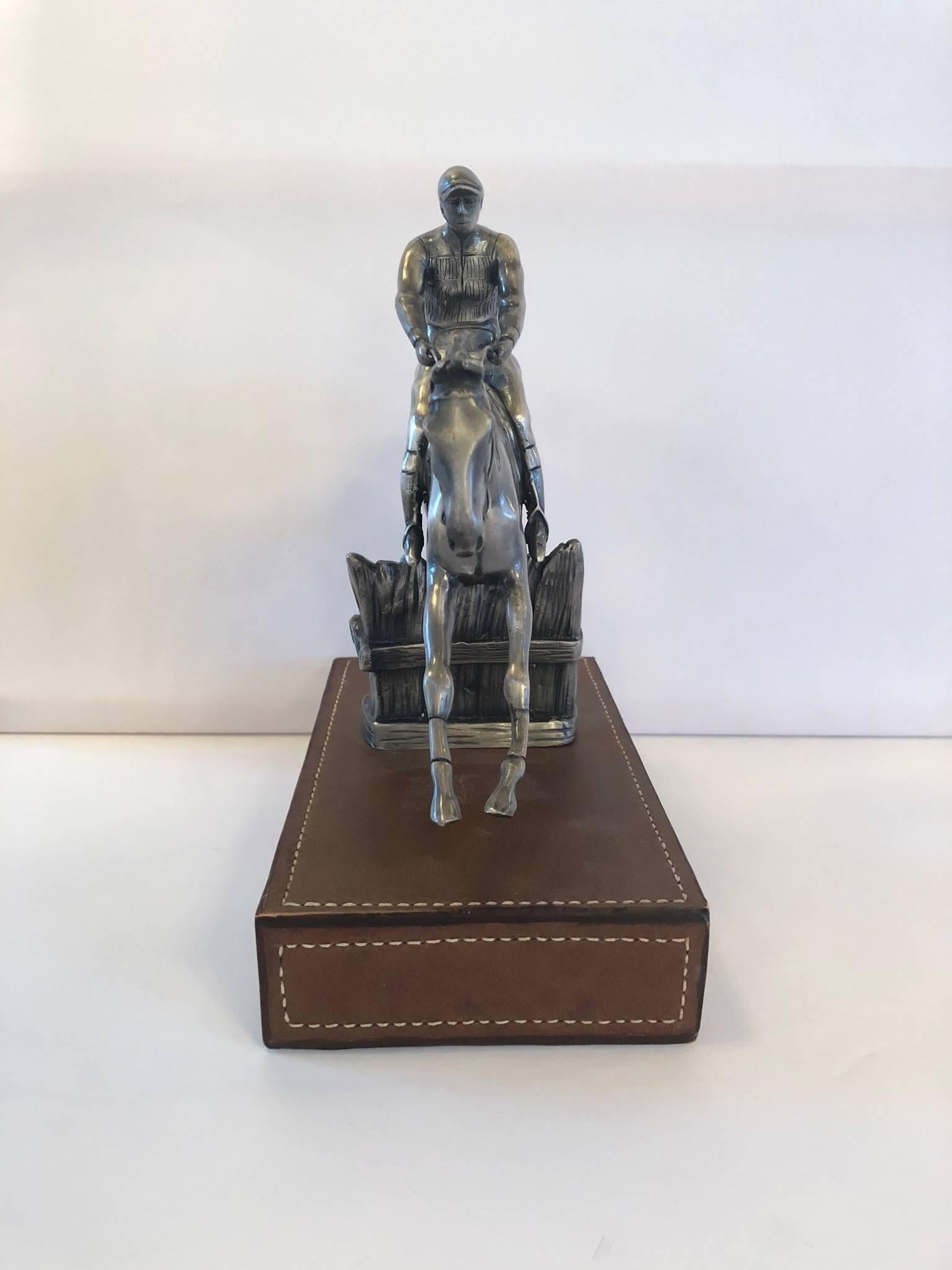 Ralph Lauren Polo statue with leather base.