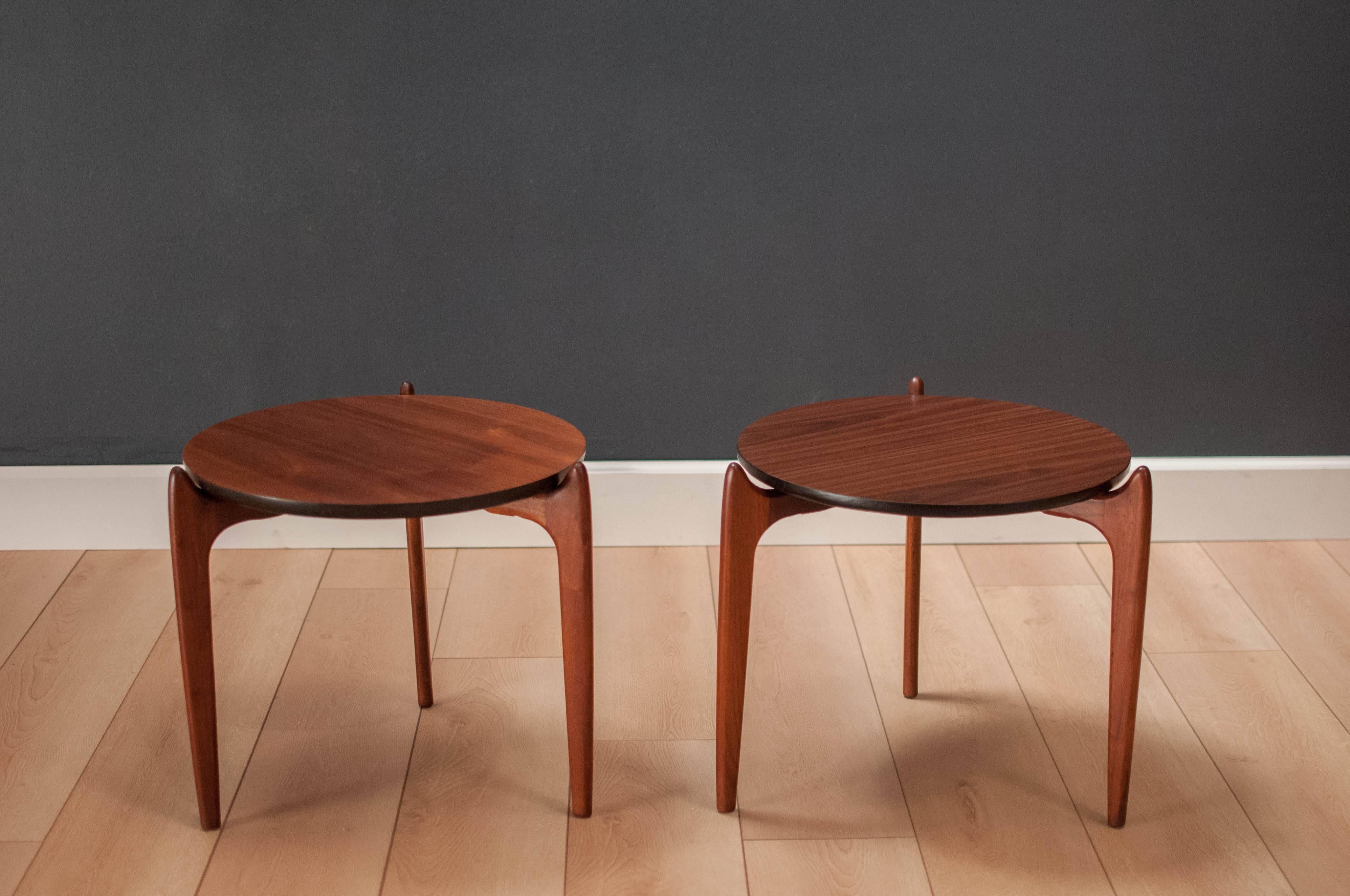 Mid-Century walnut side tables designed by Adrian Pearsall for Craft Associates. This pair features a stunning walnut grain top and sculptural wood legs. Looks great from any angle. Price is for the pair. 

