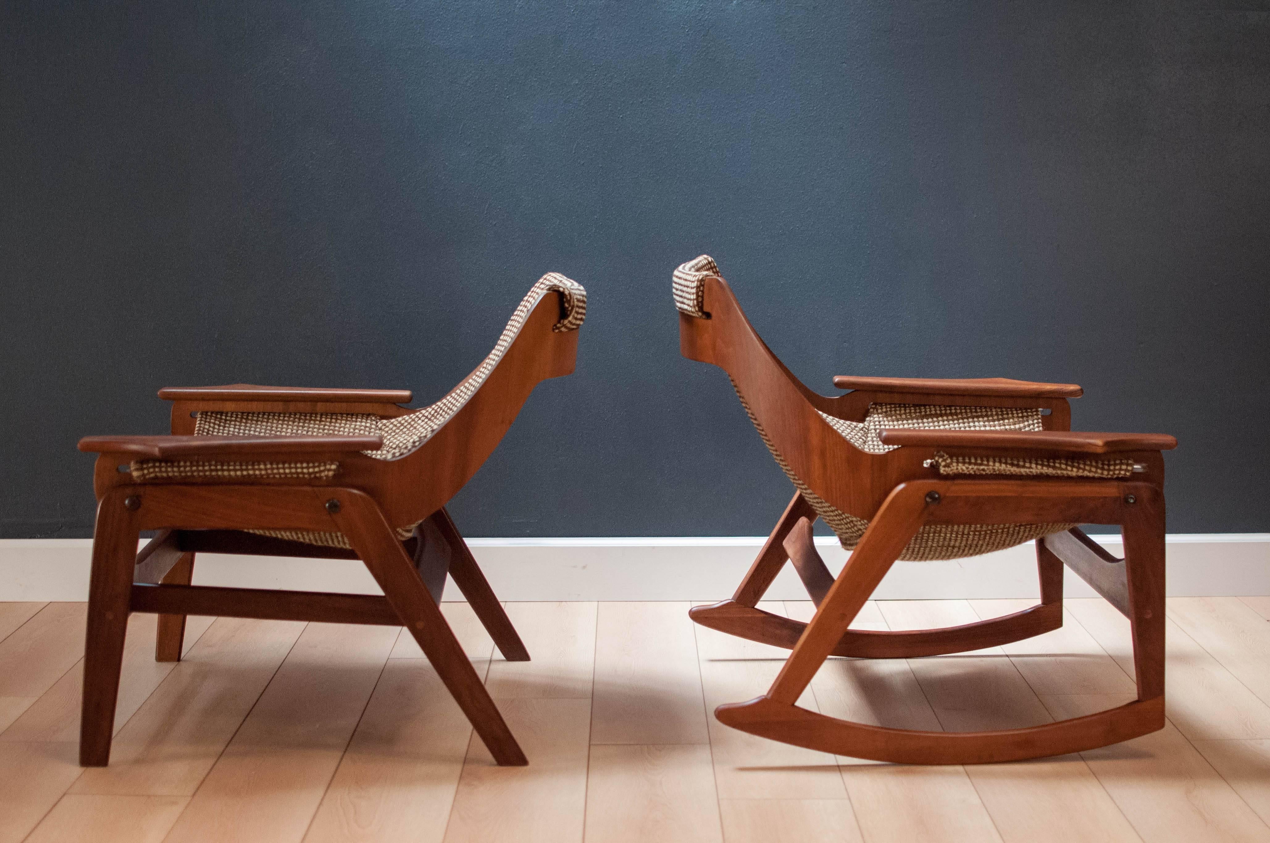 Mid-Century Jerry Johnson sling rocker and chair set in walnut. This matching pair features a sculptural walnut frame and it's original sling tweed fabric. Price is for the pair. 

Rocker: 30.25