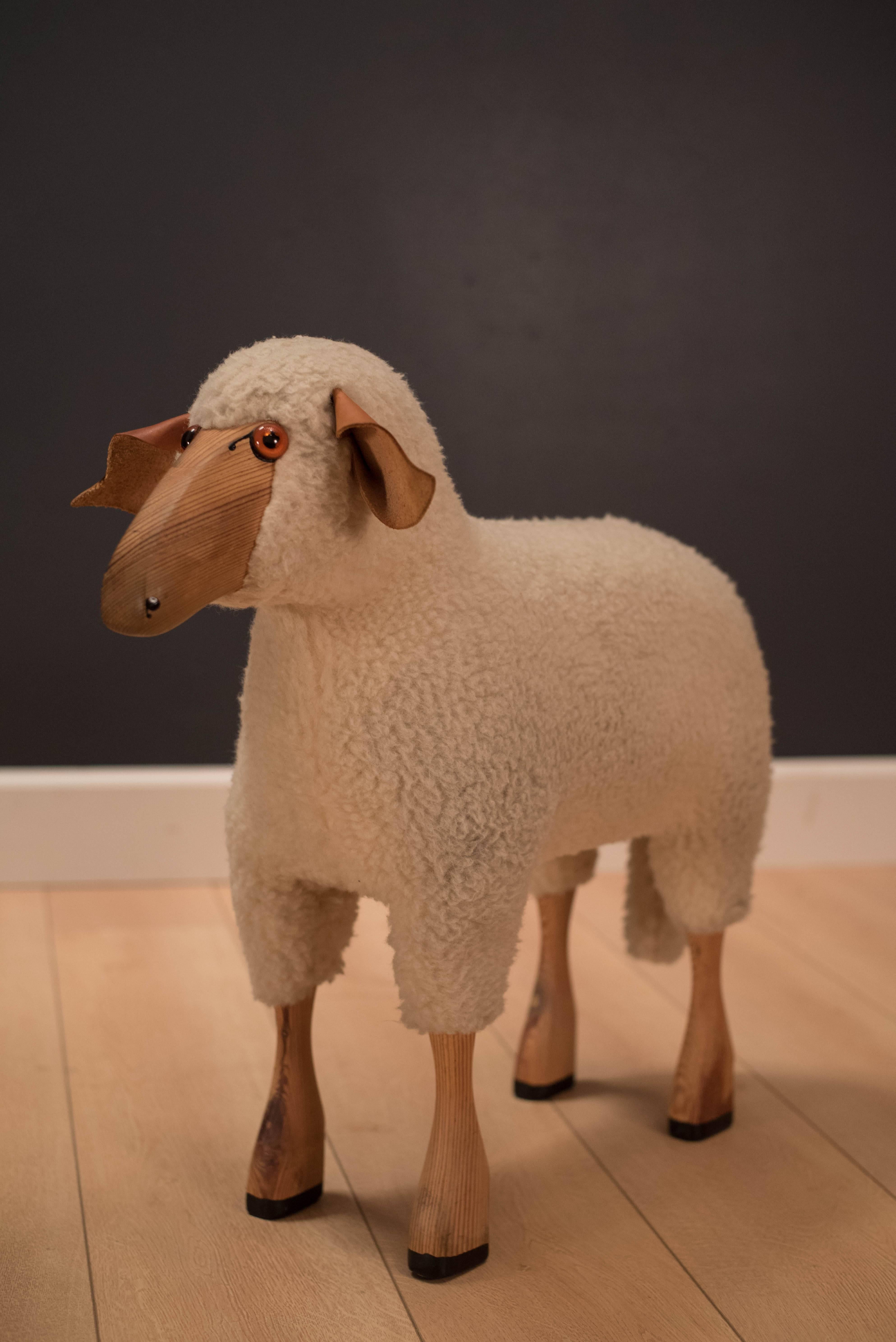 Vintage decorative sheep sculptures in the style of Claude and Francois-Xavier Lalanne. Made of genuine wool, leather, sculpted wood and glass eyes. Only white sheep is available.

.