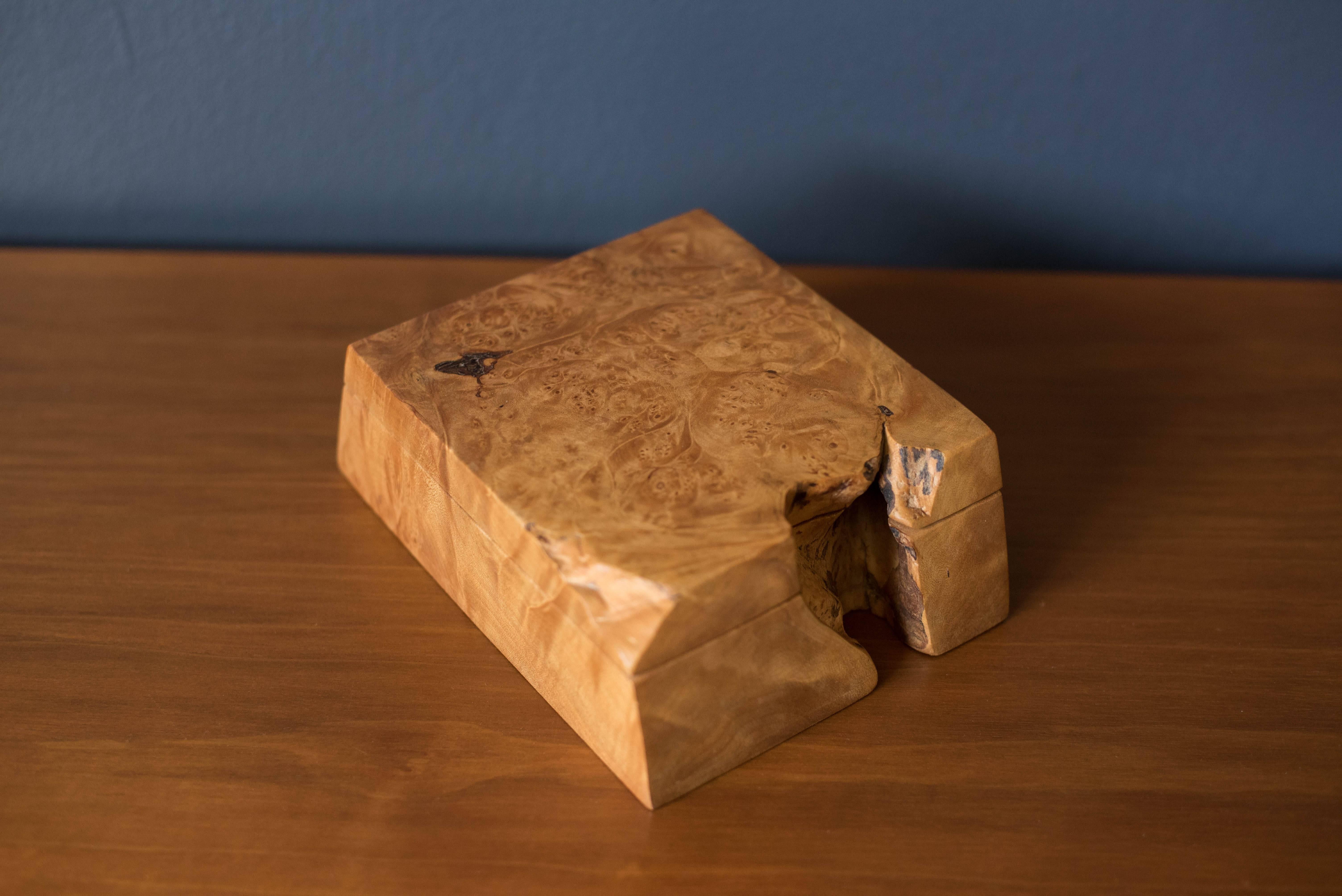 American Studio Craft jewelry or stash box by woodworker Michael Elkan. This piece features a live edge organic shape and is made of olive burl wood.

