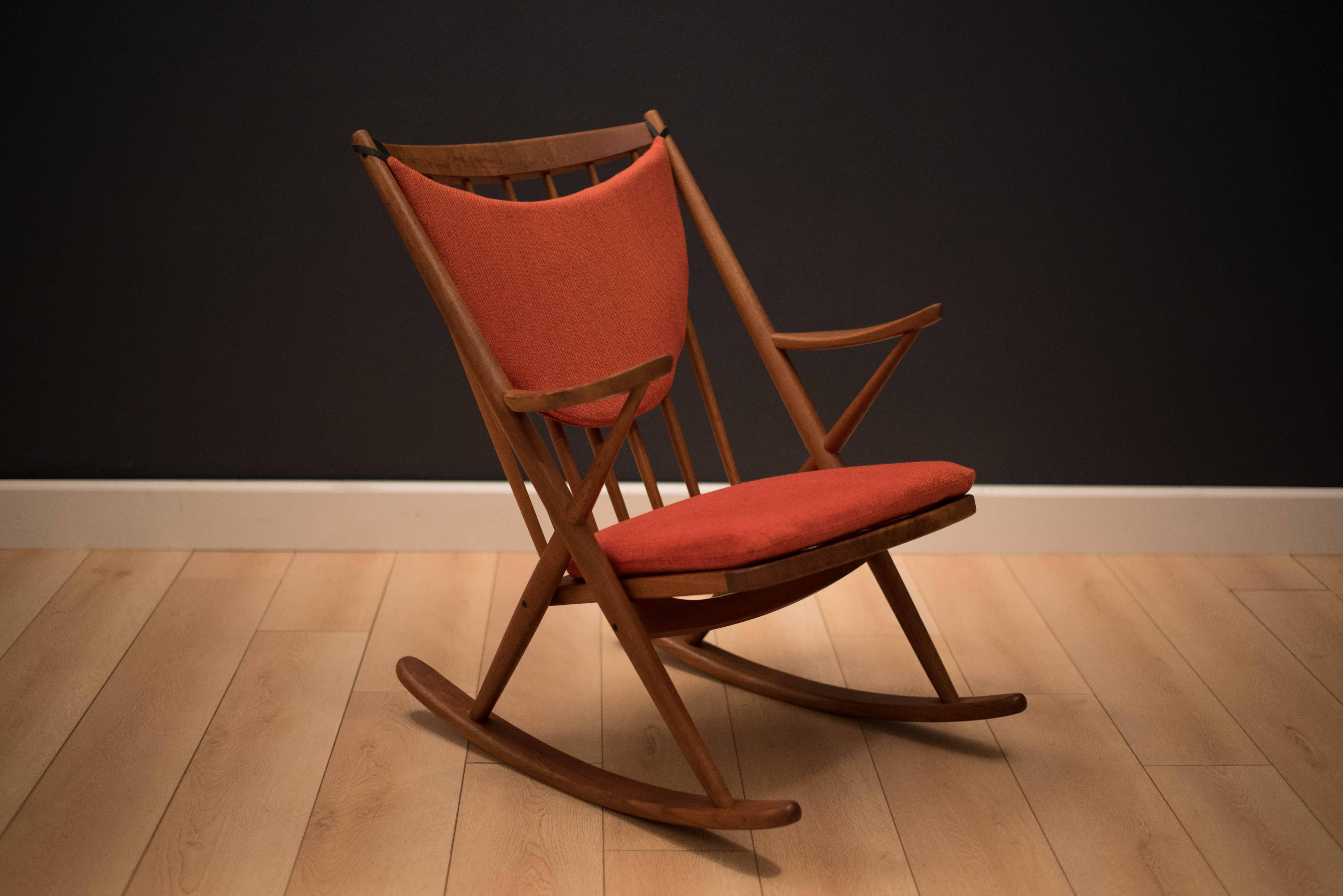 Mid-Century Danish teak rocker by Frank Reenskaug for Bramin. This piece was built with a solid teak frame and includes original fabric in red/orange tweed. Displays well from any angle.
      
     