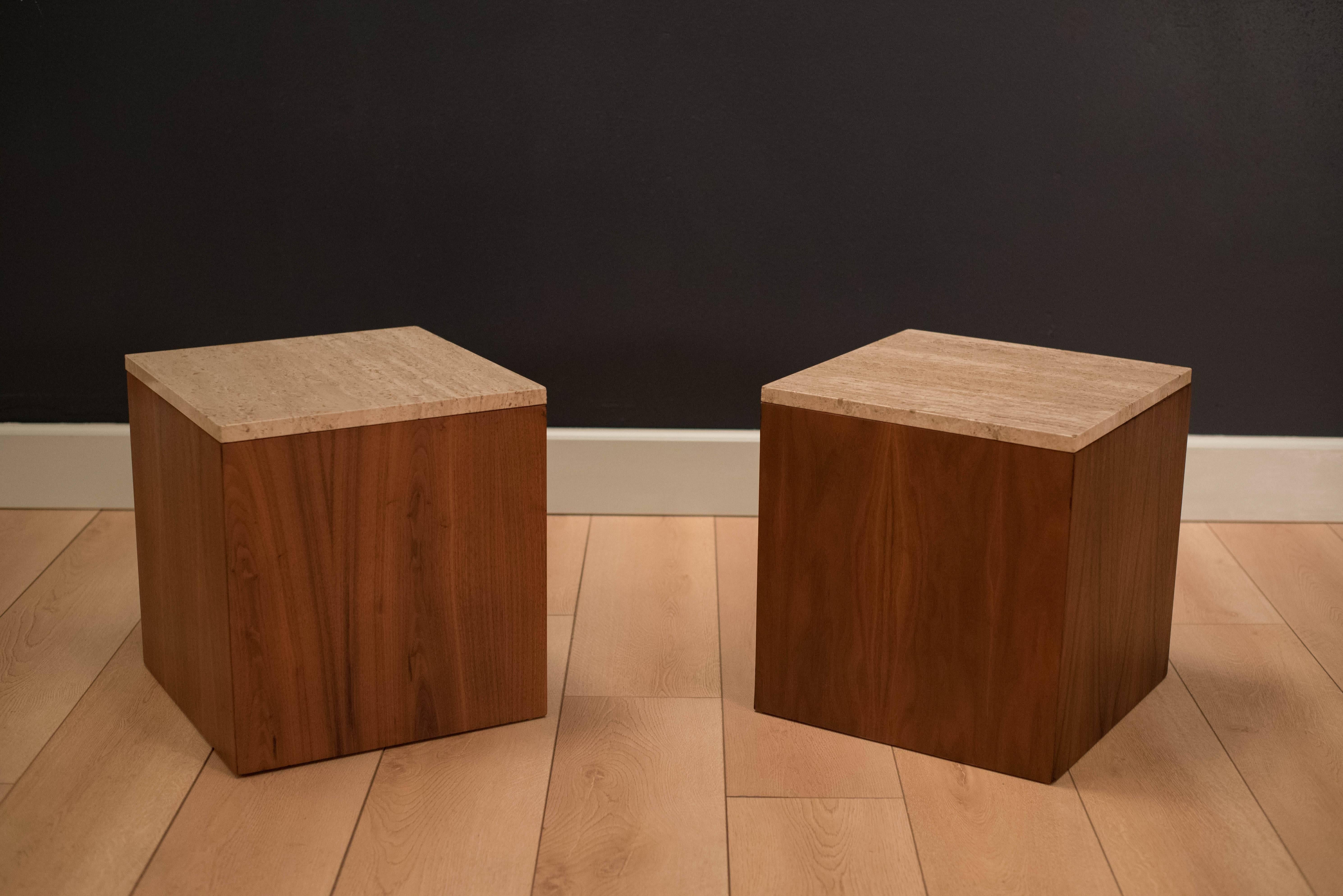 Mid-Century walnut cube end tables with travertine tops. Price is for the pair.

 