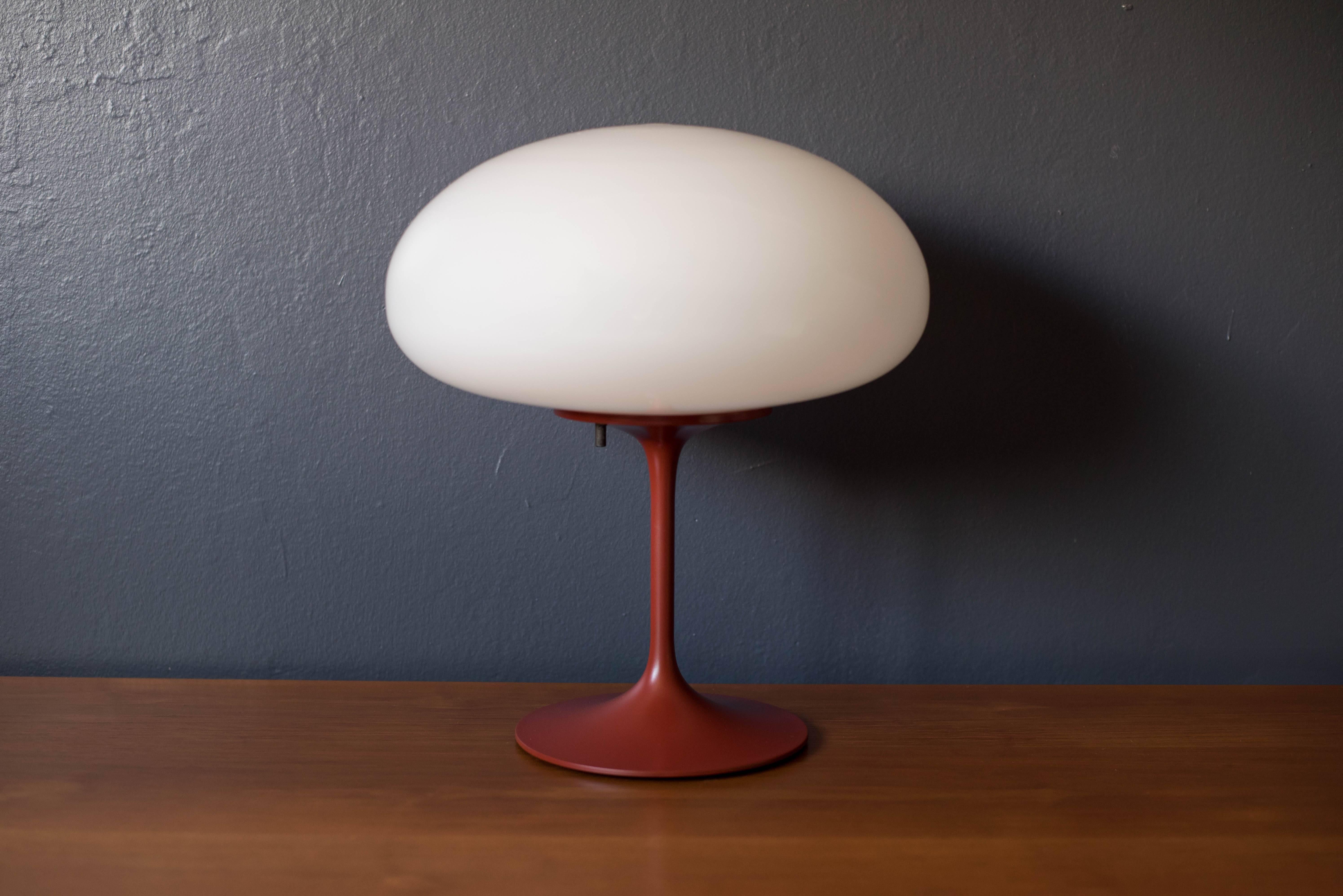 Vintage Stemlite lamp by Bill Curry for Design Line. This piece features a white glass globe and a red enamel finish.

Dimensions: 13