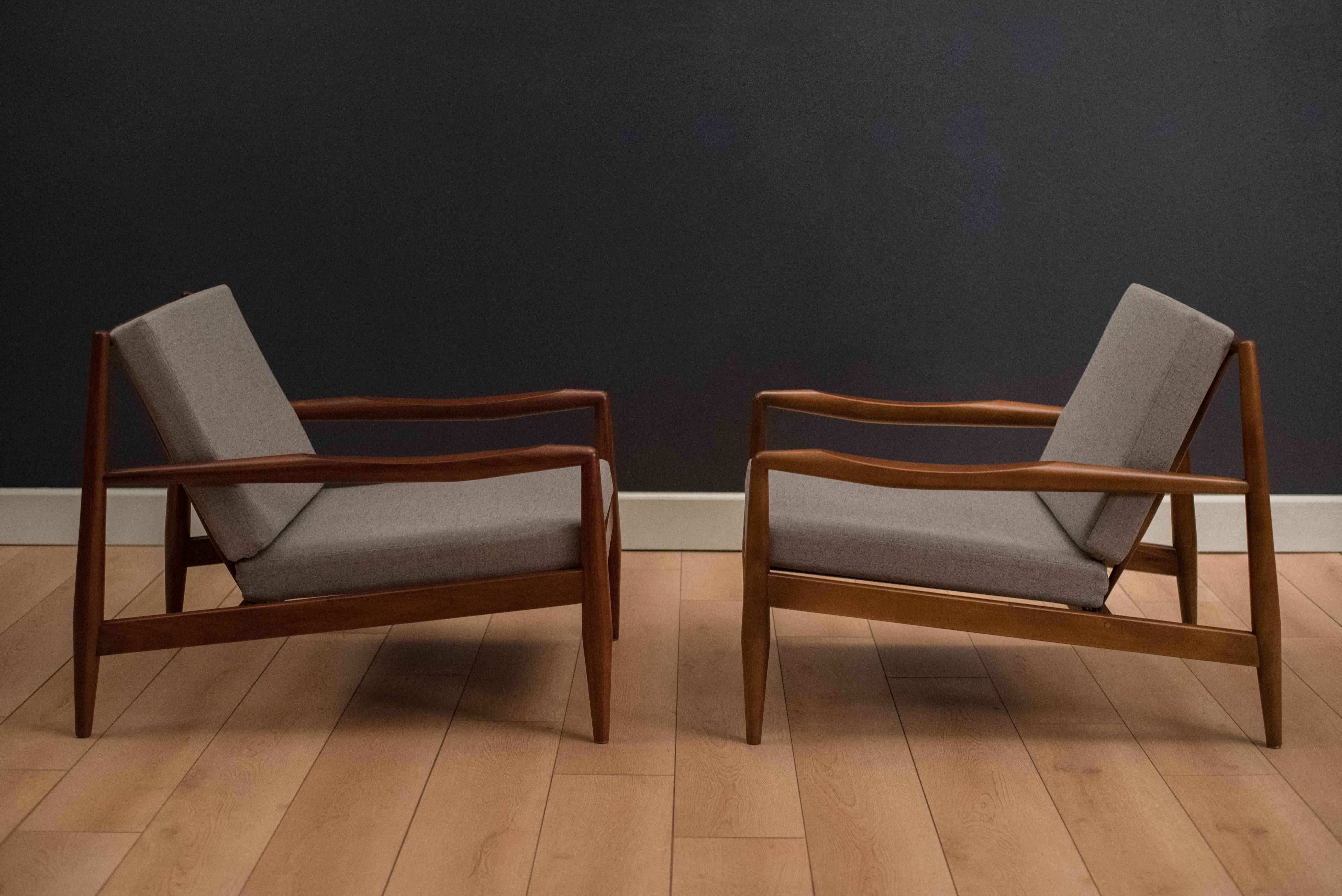 Mid-Century Adrian Pearsall 843-C lounge chairs for Craft Associates in walnut. This pair features a sculpted walnut frame with new grey tweed fabric and foam. Price is for the pair. 

 
