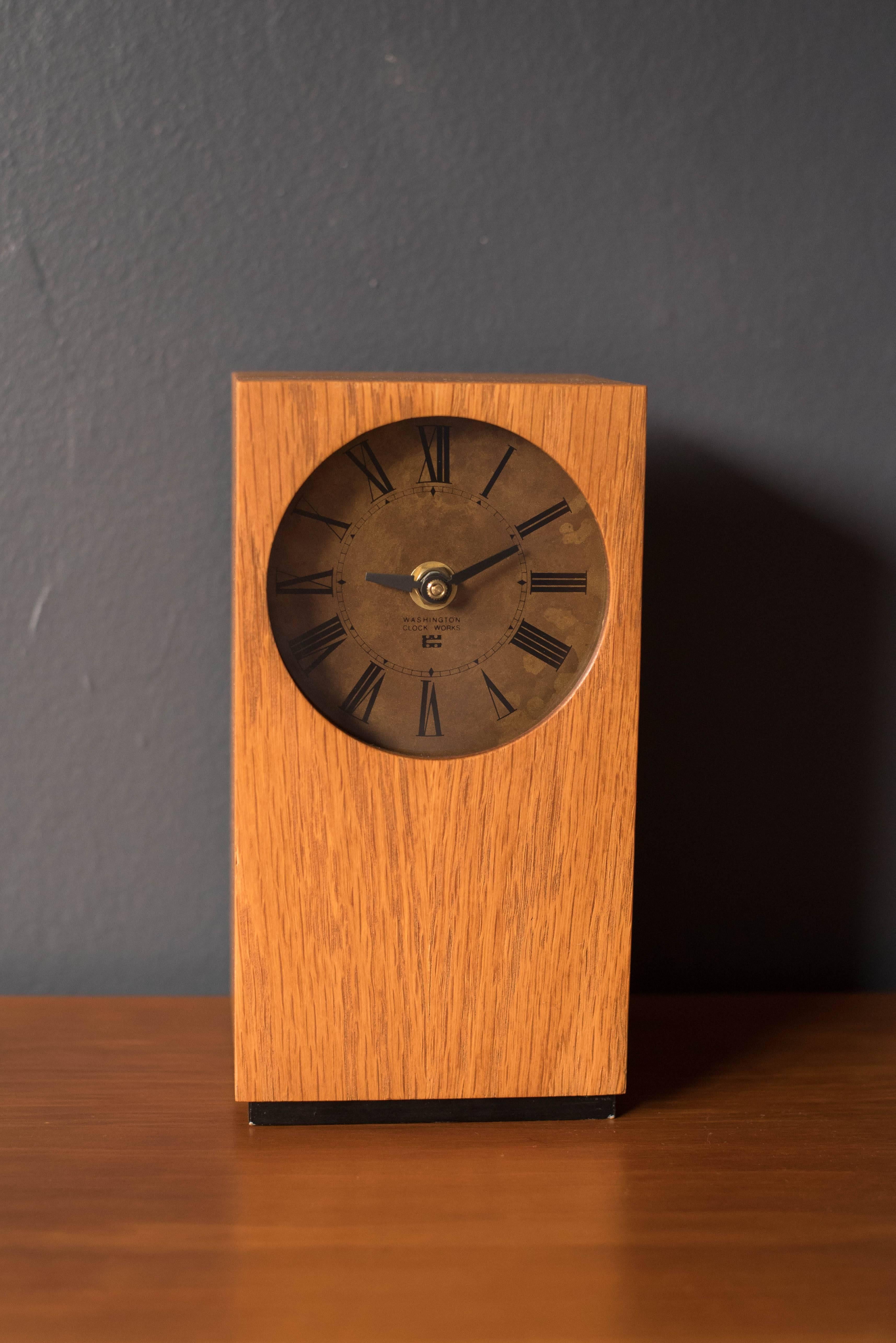 Mid-Century Modern desk clock made by Washington Clock Works. The piece is encased in oak and is in good working condition. Runs on one AA battery.

 