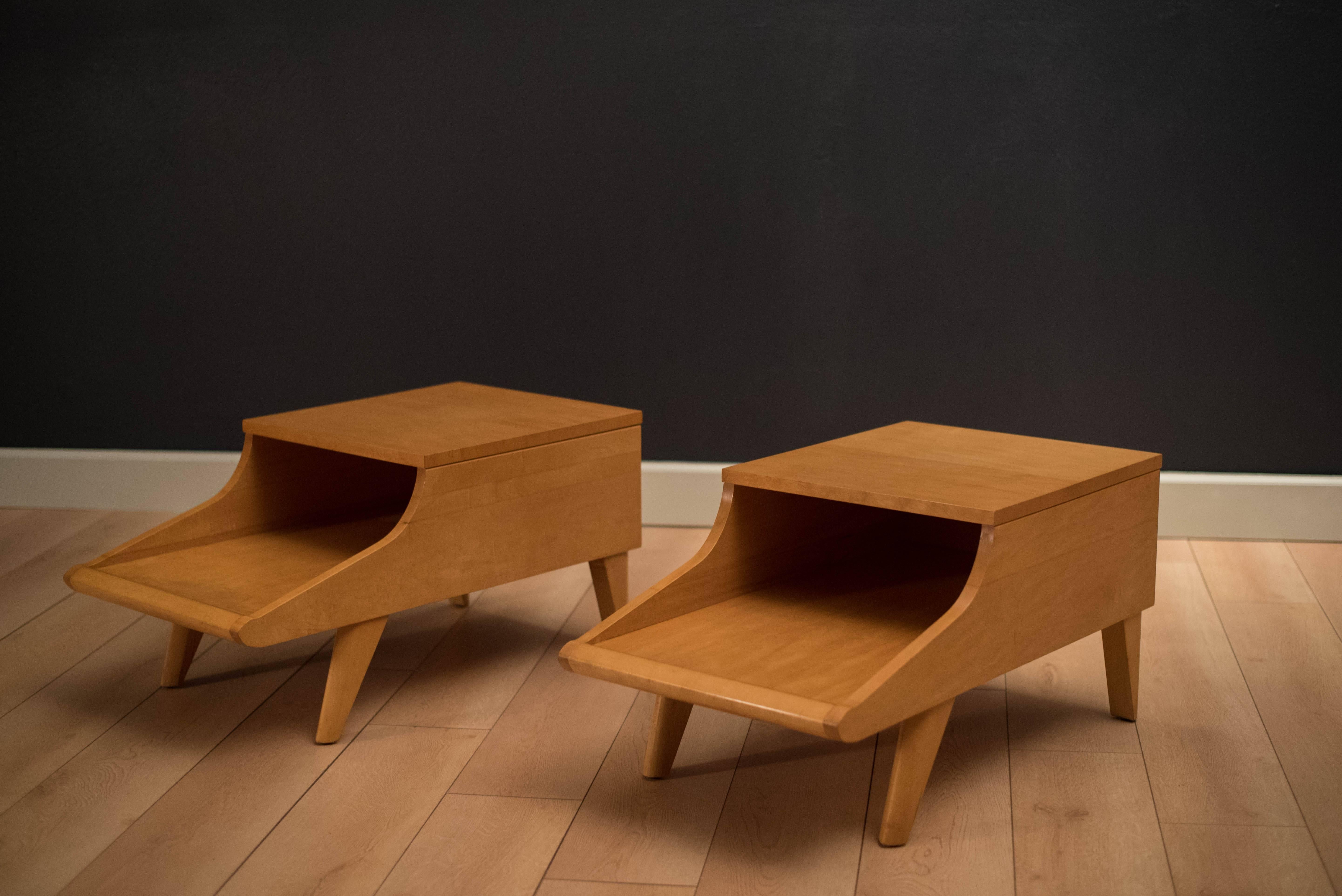 Vintage side tables designed by John Keal for Brown Saltman. This two-tier table set features unique splayed legs and is constructed of solid planked maple. Price is for the pair.