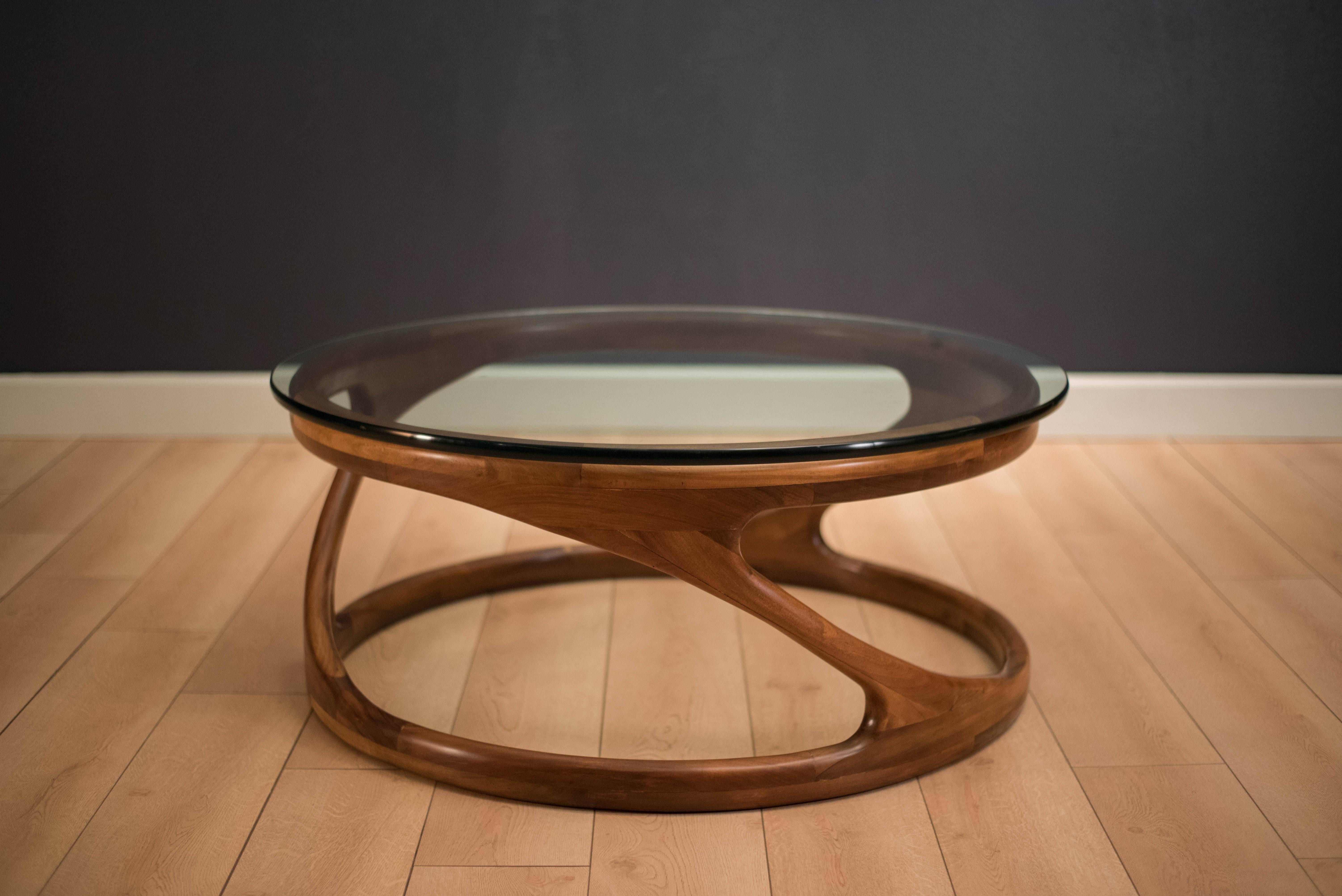 Vintage Studio Craft glass coffee table, circa 1960s. This piece features a round 3/4