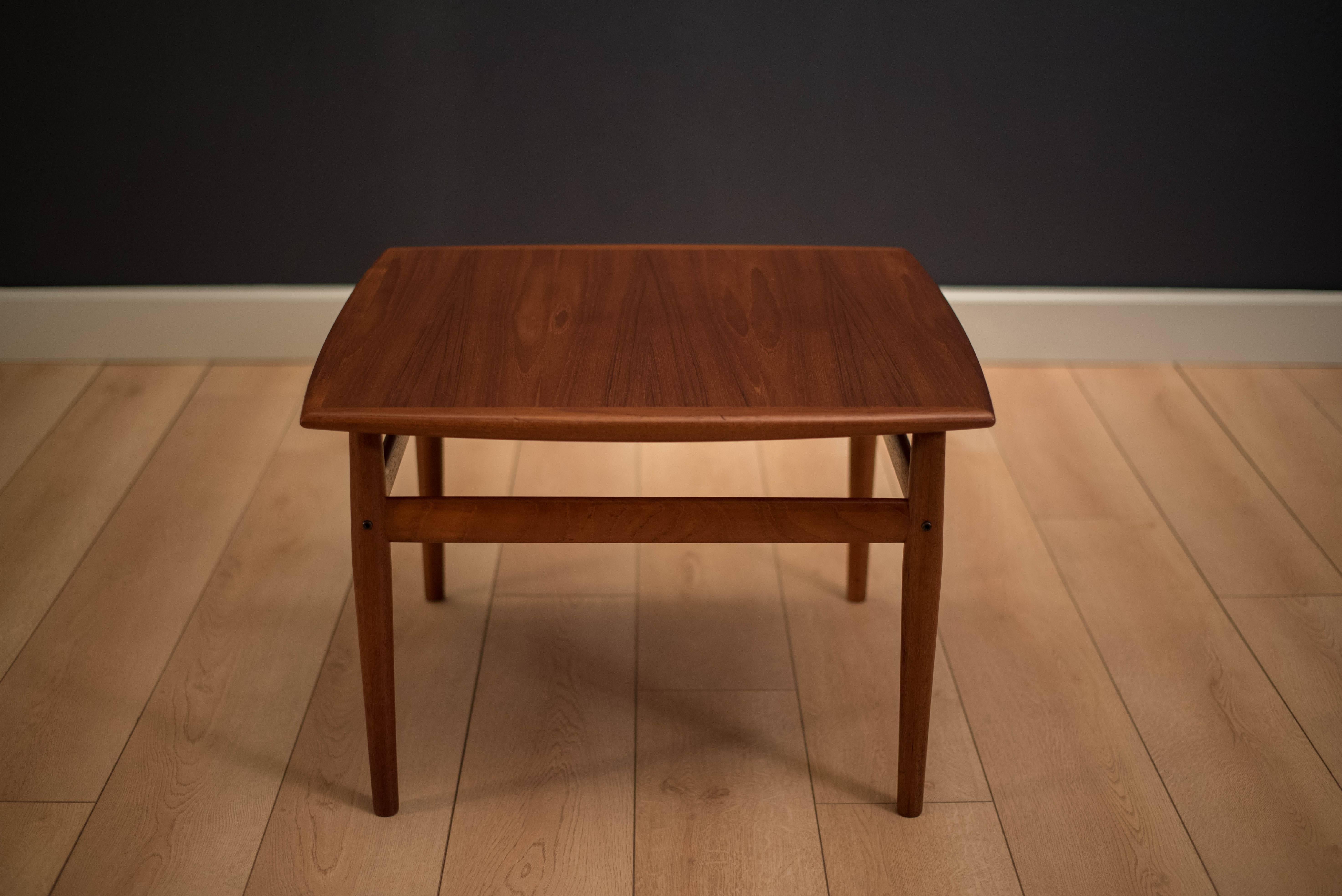 Mid-Century Modern table by Grete Jalk for Glostrup Mobelfabrik in teak. This piece can be used as a coffee table or side occasional table.