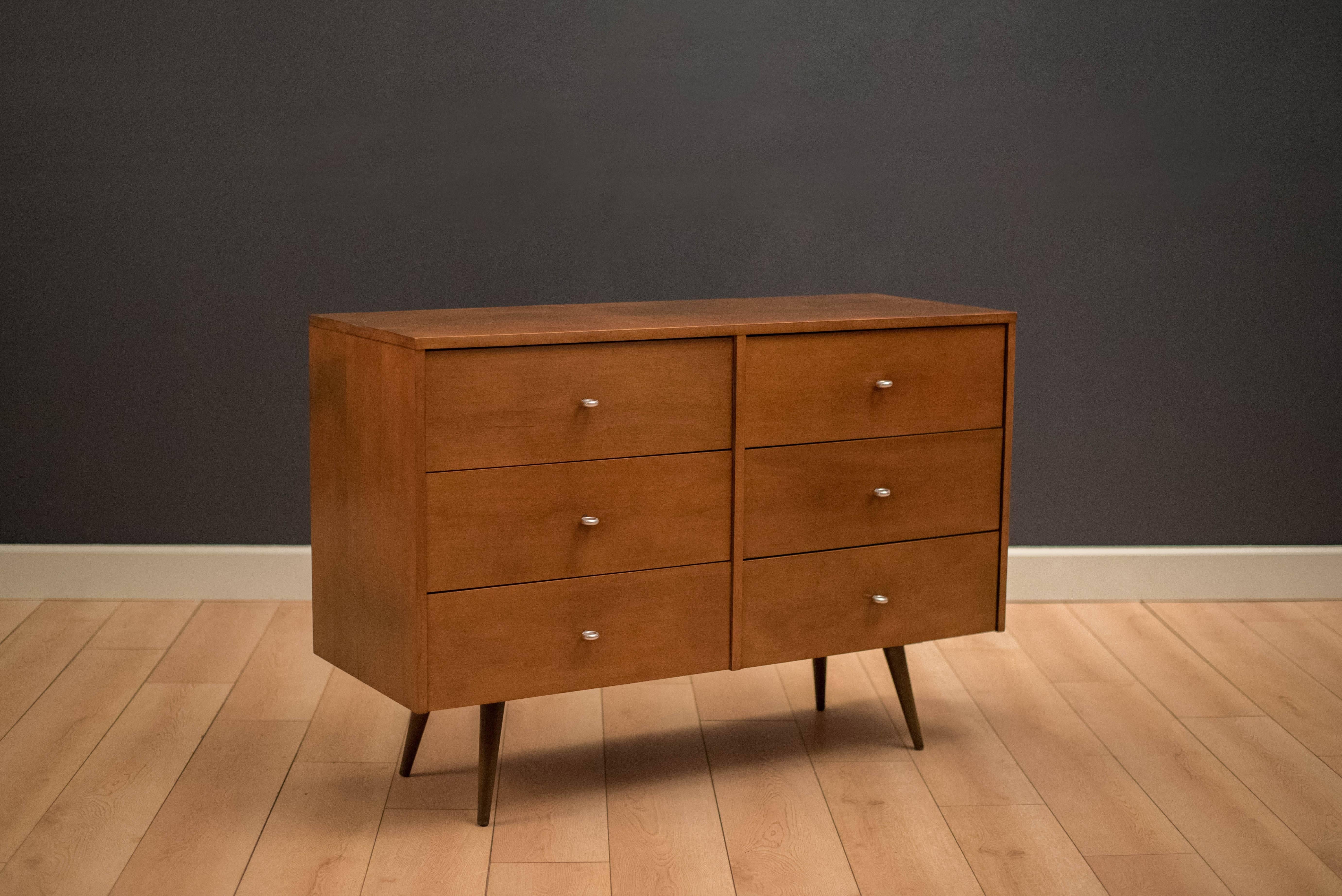 Mid-Century Planner Group dresser designed by Paul McCobb for Winchendon. This piece provides plenty of storage with six drawers and is accessorized with McCobb's signature aluminum pulls.
 