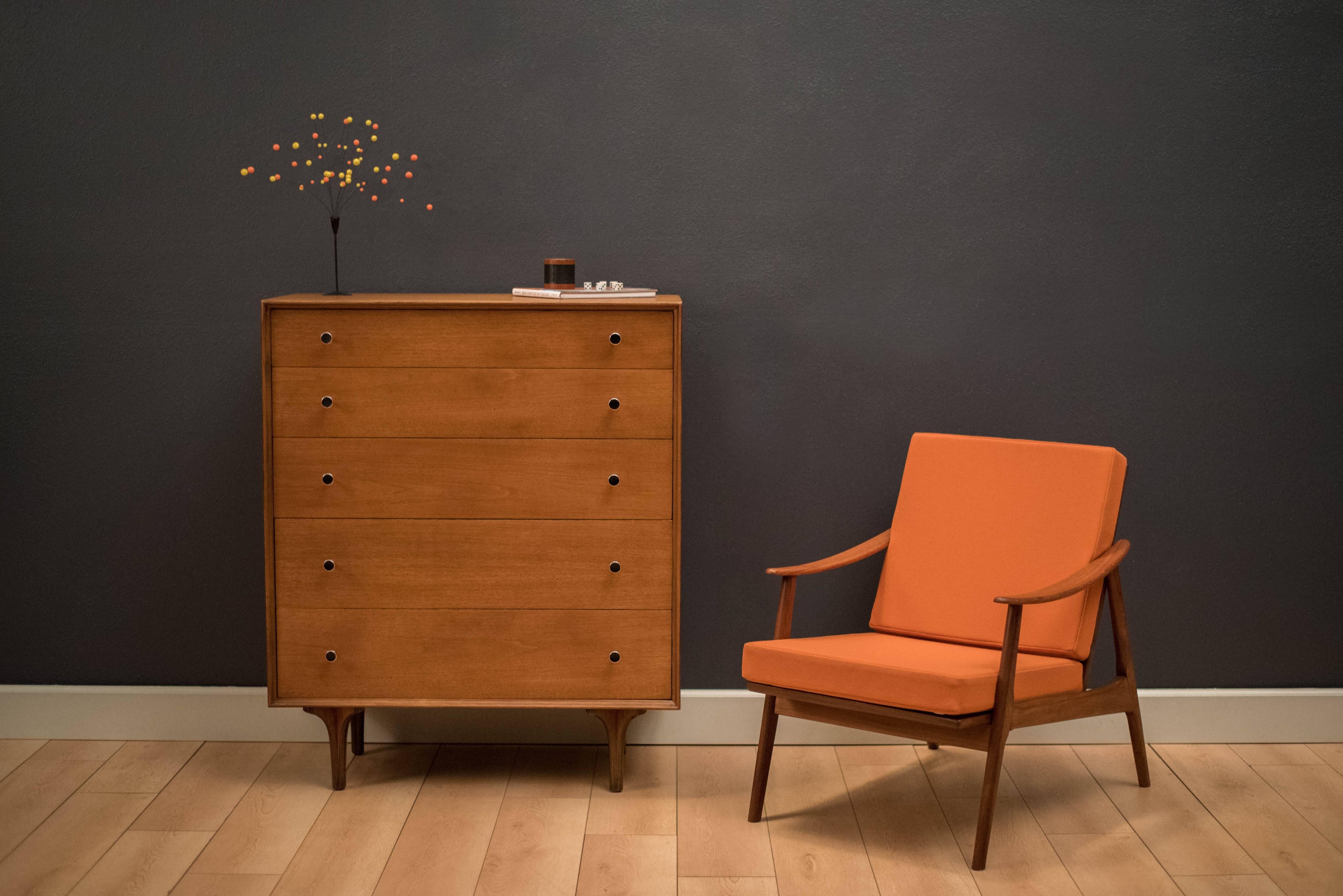 Mid-Century Modern Glenn of California tall dresser in walnut by Richard Thompson. This chest features five deep drawers that provide ample storage space and unique bent plywood legs. Drawers are accessorized by the designer's signature pulls. Case