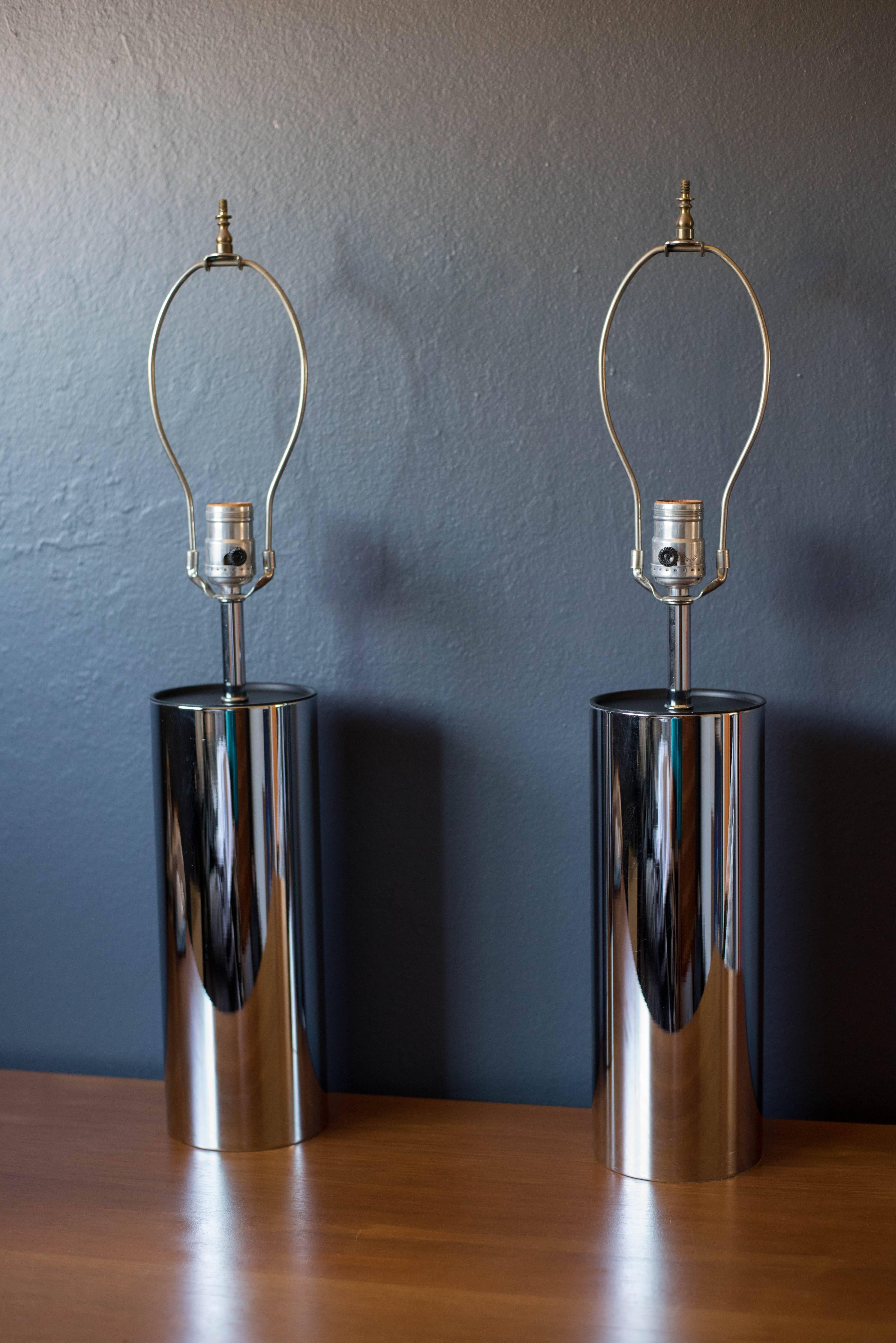 Pair of tall chrome lamps by George Kovacs, 1970s. This set is cylinder shaped and includes a three way switch mechanism. Shades are not included. Price is for the pair.