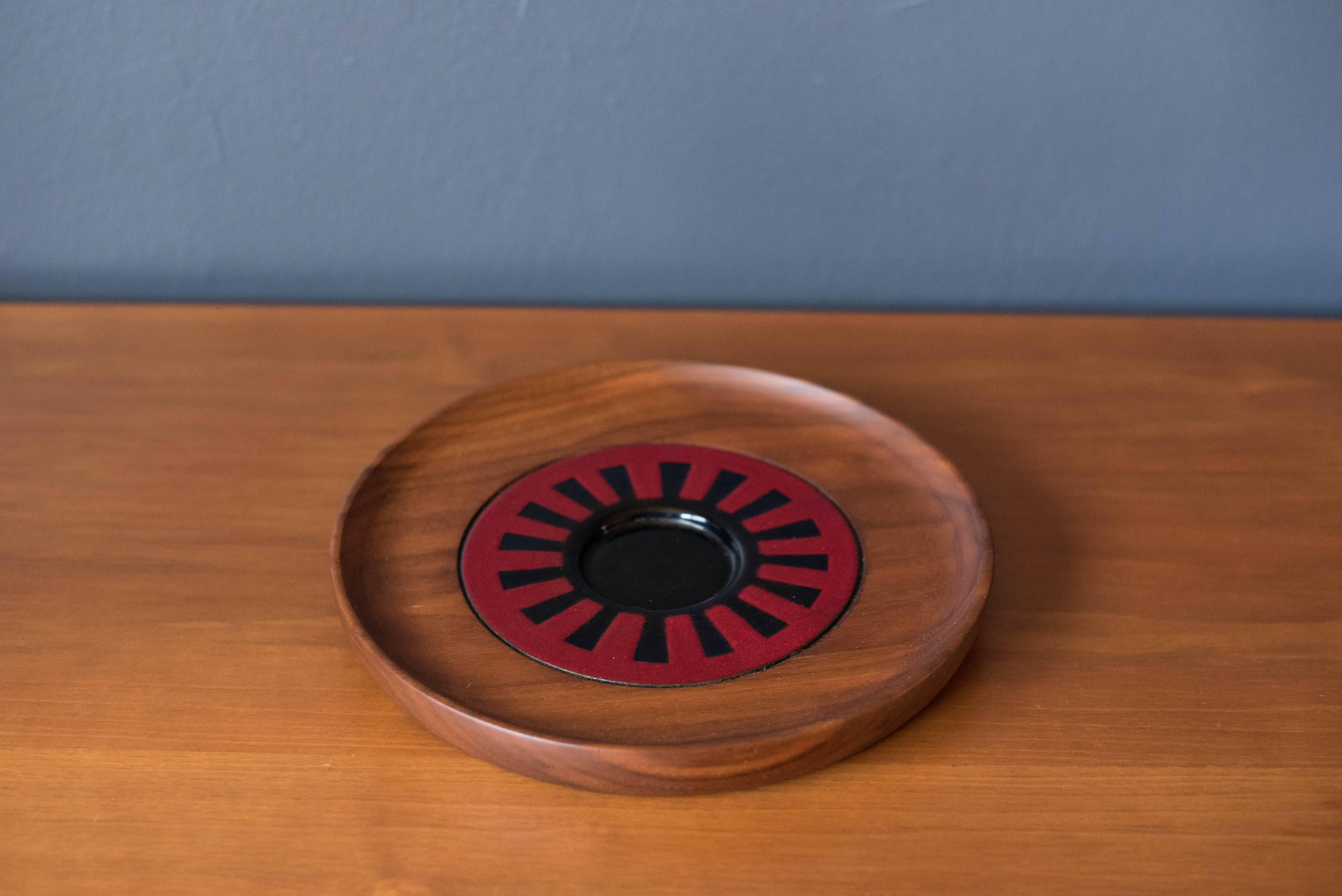 Vintage decorative serving dish designed by Richard Grossenbach for Raymor. This hand-turned walnut piece features sculptural raised edges and a vibrant ceramic insert.