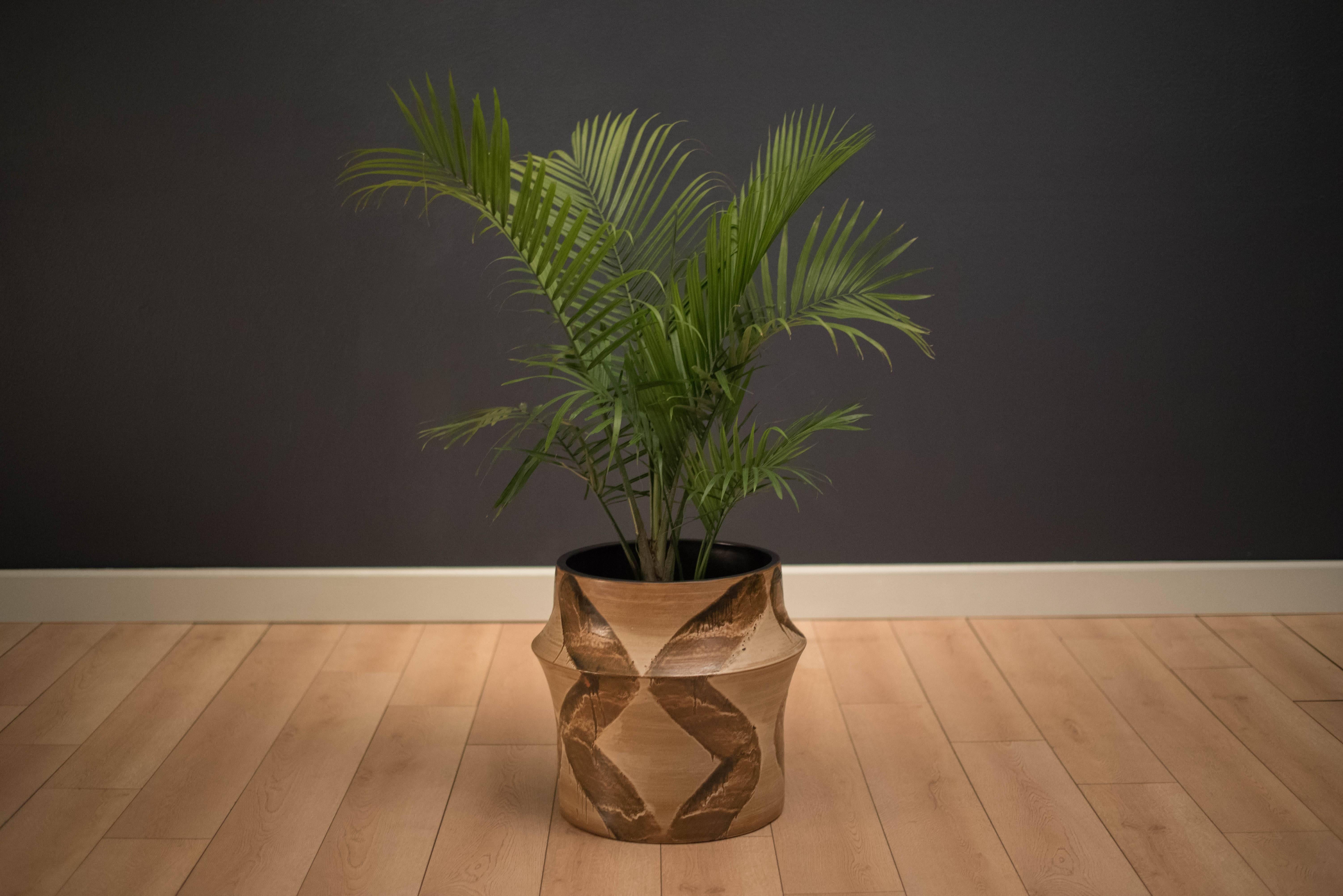 Mid century large studio ceramic planter pot, circa 1970s. This piece features a unique modernist form with a drip glaze matte finish. 

Interior: 15