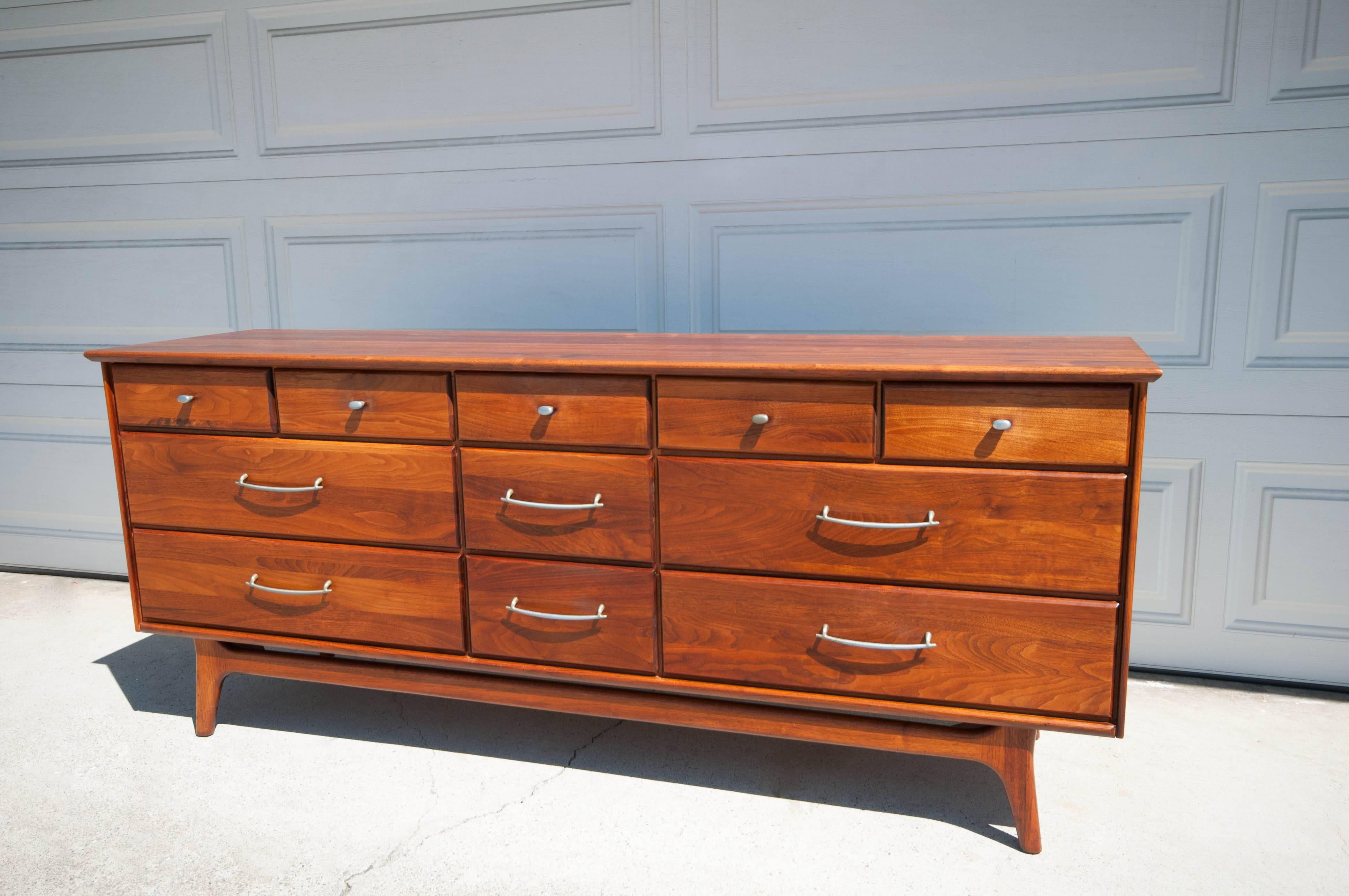 Midcentury Ace-Hi Dresser in solid planked walnut. This piece features eleven spacious drawers with pewter pulls. Can also be used as an entertainment console or credenza.
