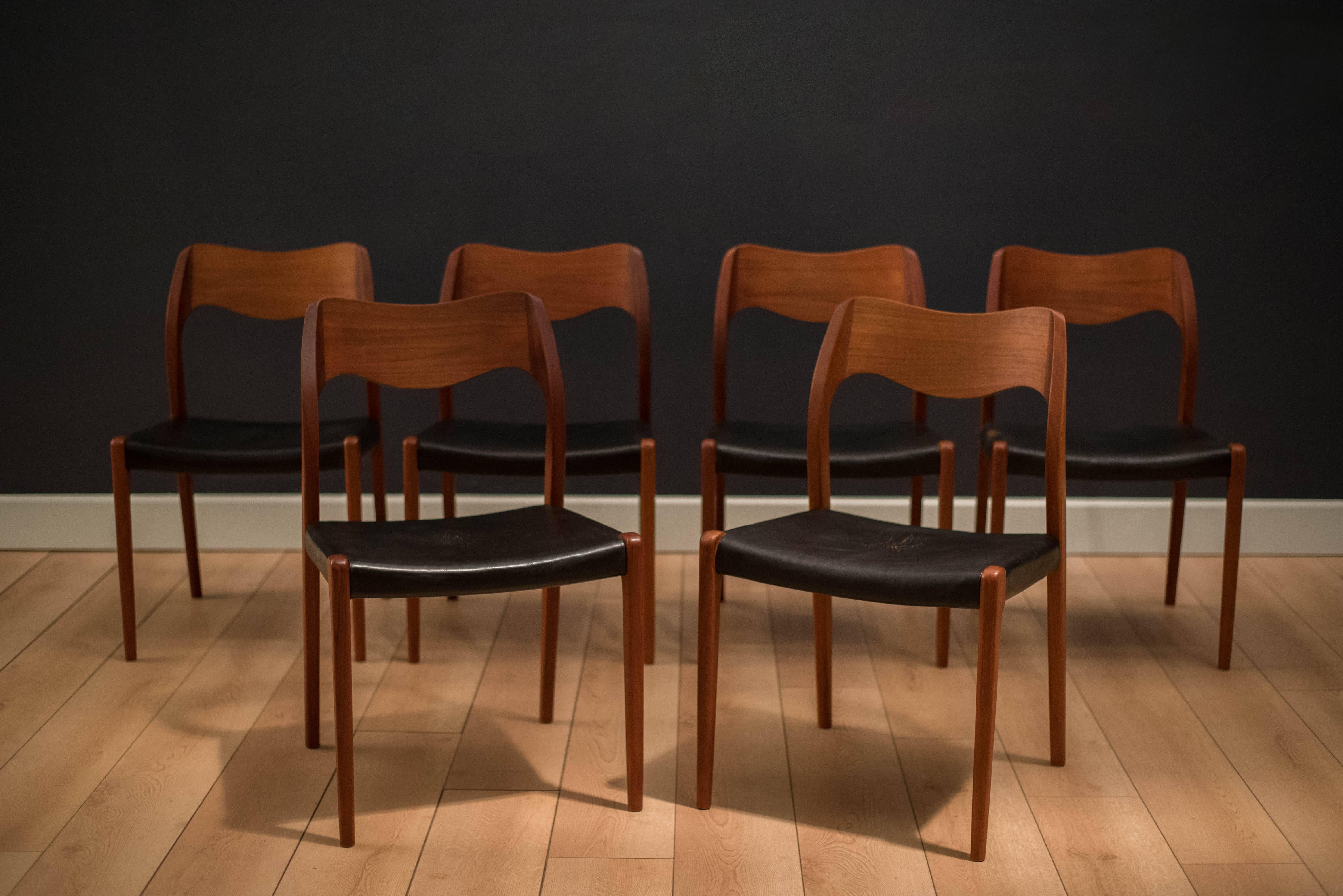 Mid Century Teak Danish Dining Chairs by Niels Møller for J.L. Møller Møbelfabrik Model #71. Set includes six chairs with original black leather upholstery with age appropriate patina. 

