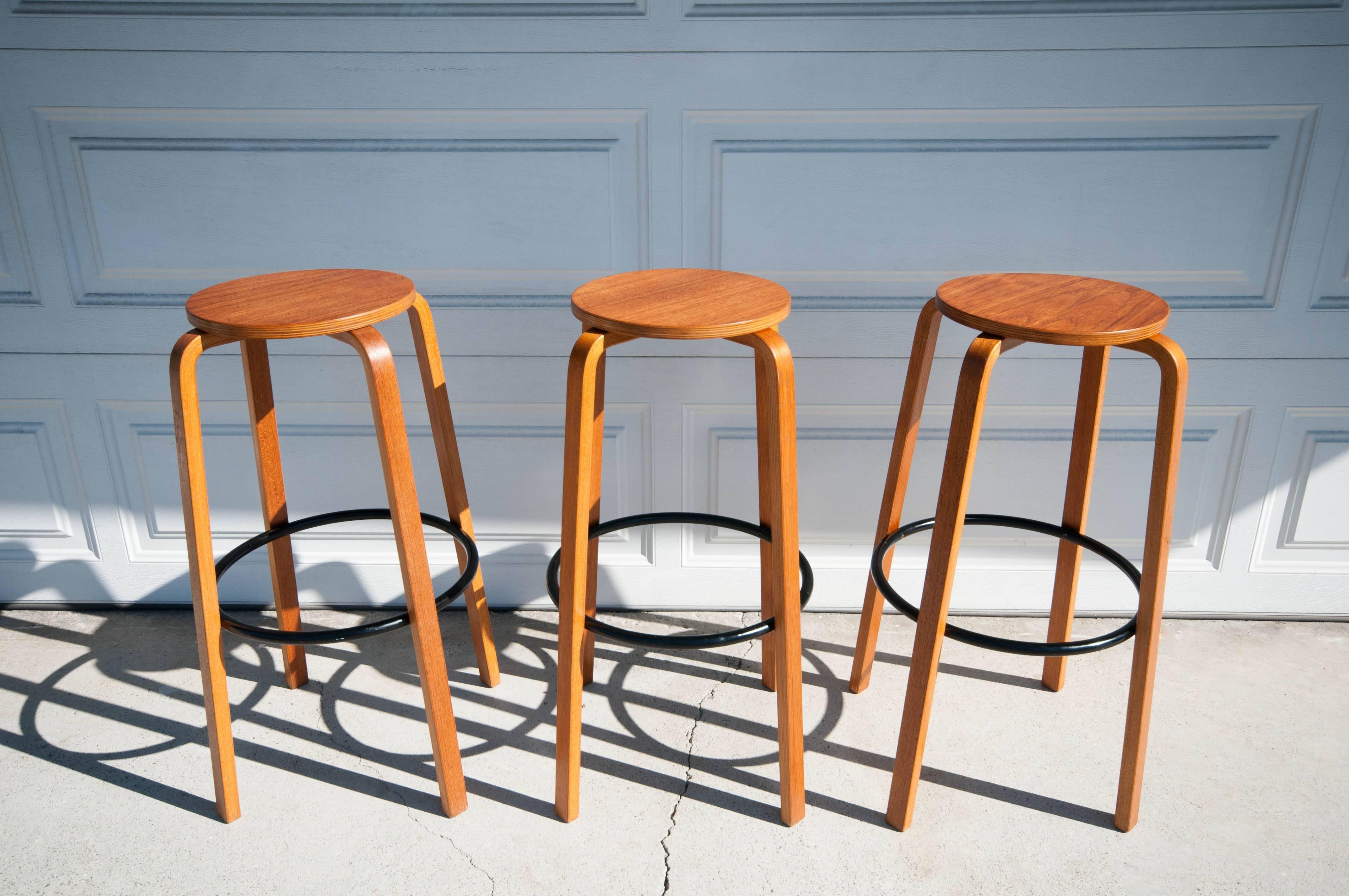 Mid Century Modern Bar Stools in teak and birch bentwood. This set of three stools are in the style of Alvar Aalto and are marked made in Denmark. Price is for the set of three bar stools. 

Seat: 12