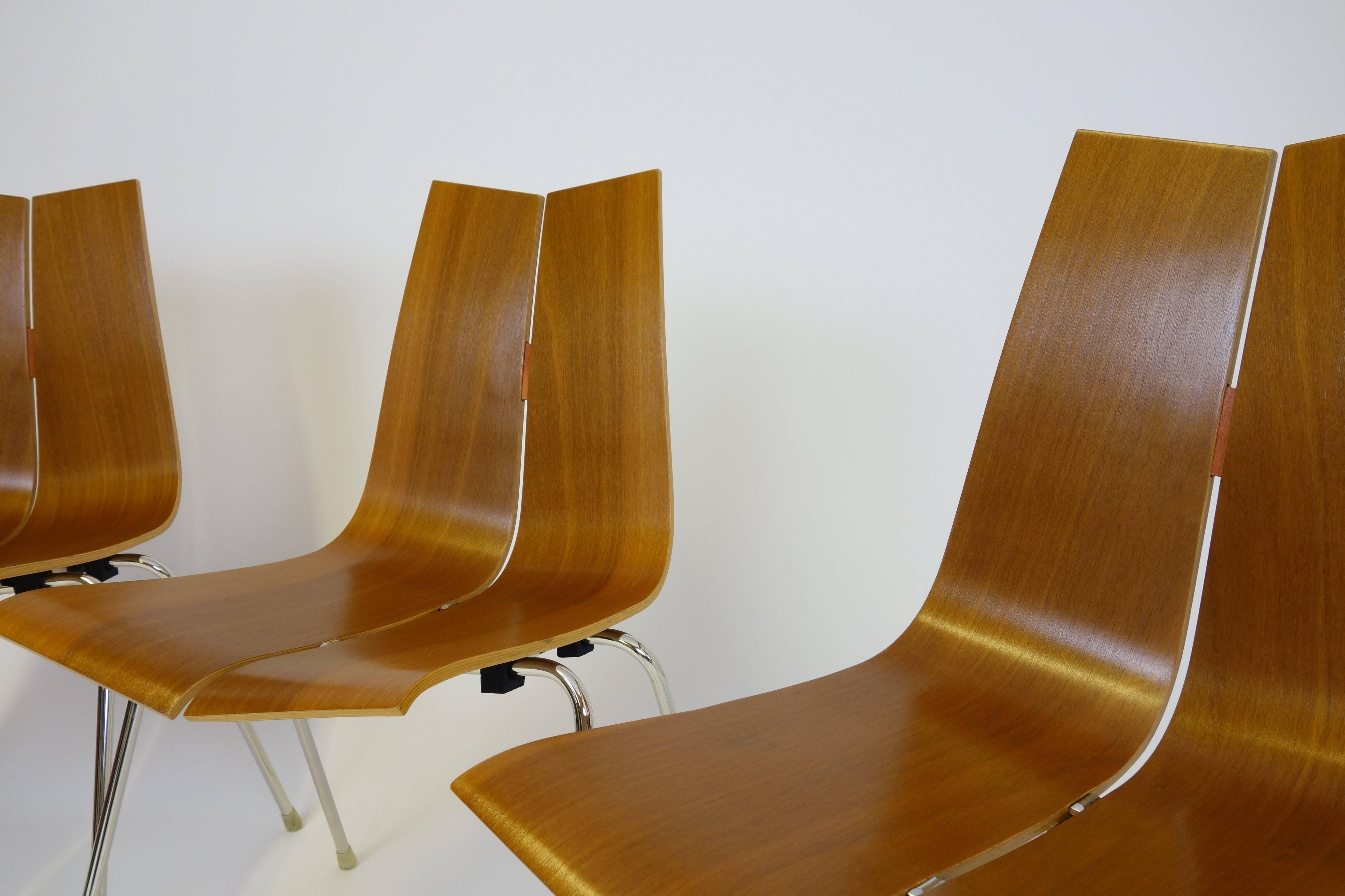 Four GA stacking chairs designed by Hans Bellmann for Horgen-Glarus, Switzerland, 1952.
The seating and backrest are made of moulded plywood finished in veneered teak wood. The nickel-plated steel legs and the veneered seating have been carefully