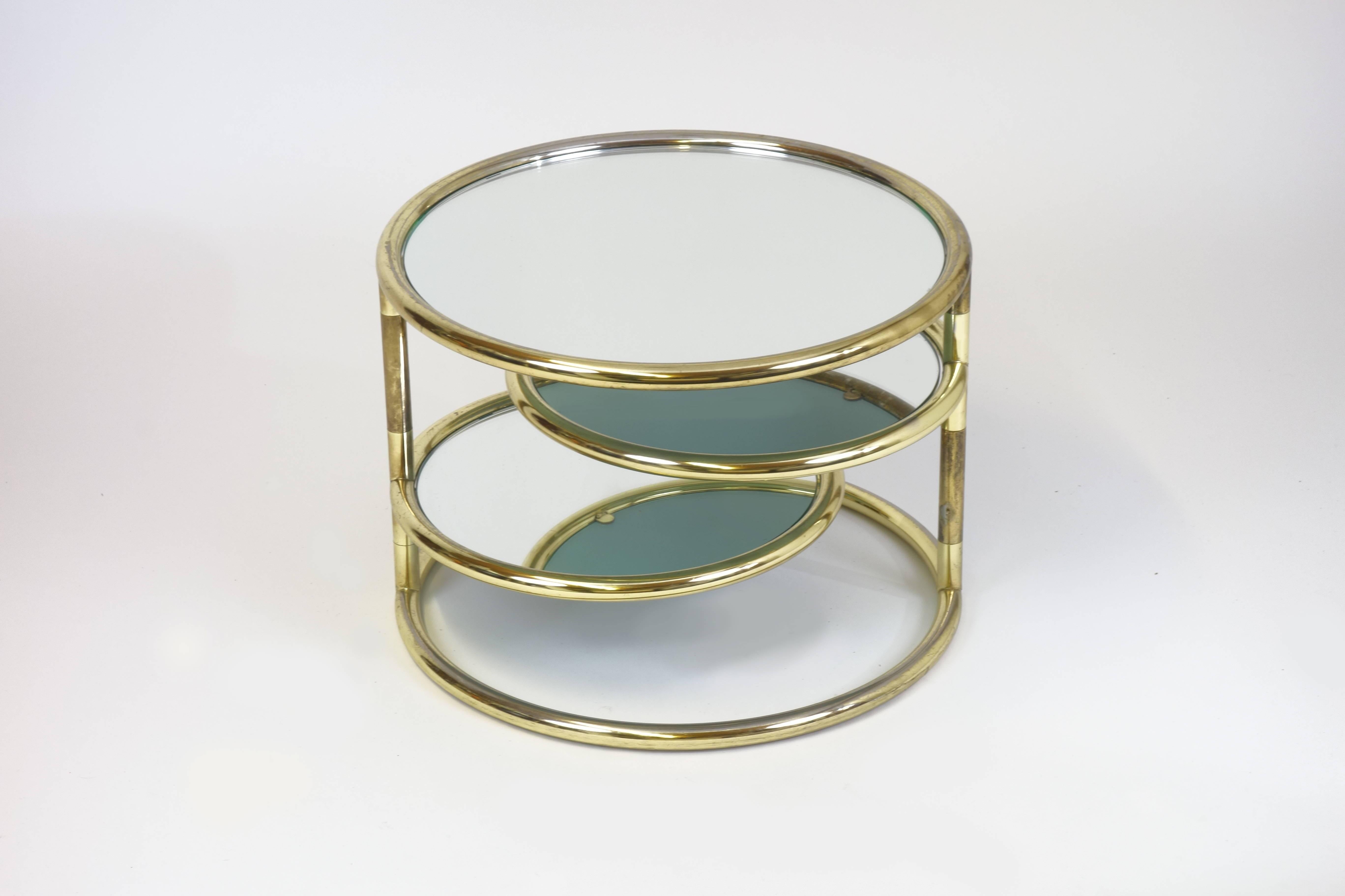 Sidetable made of gilded tubular frame with adjustable mirrored tops.