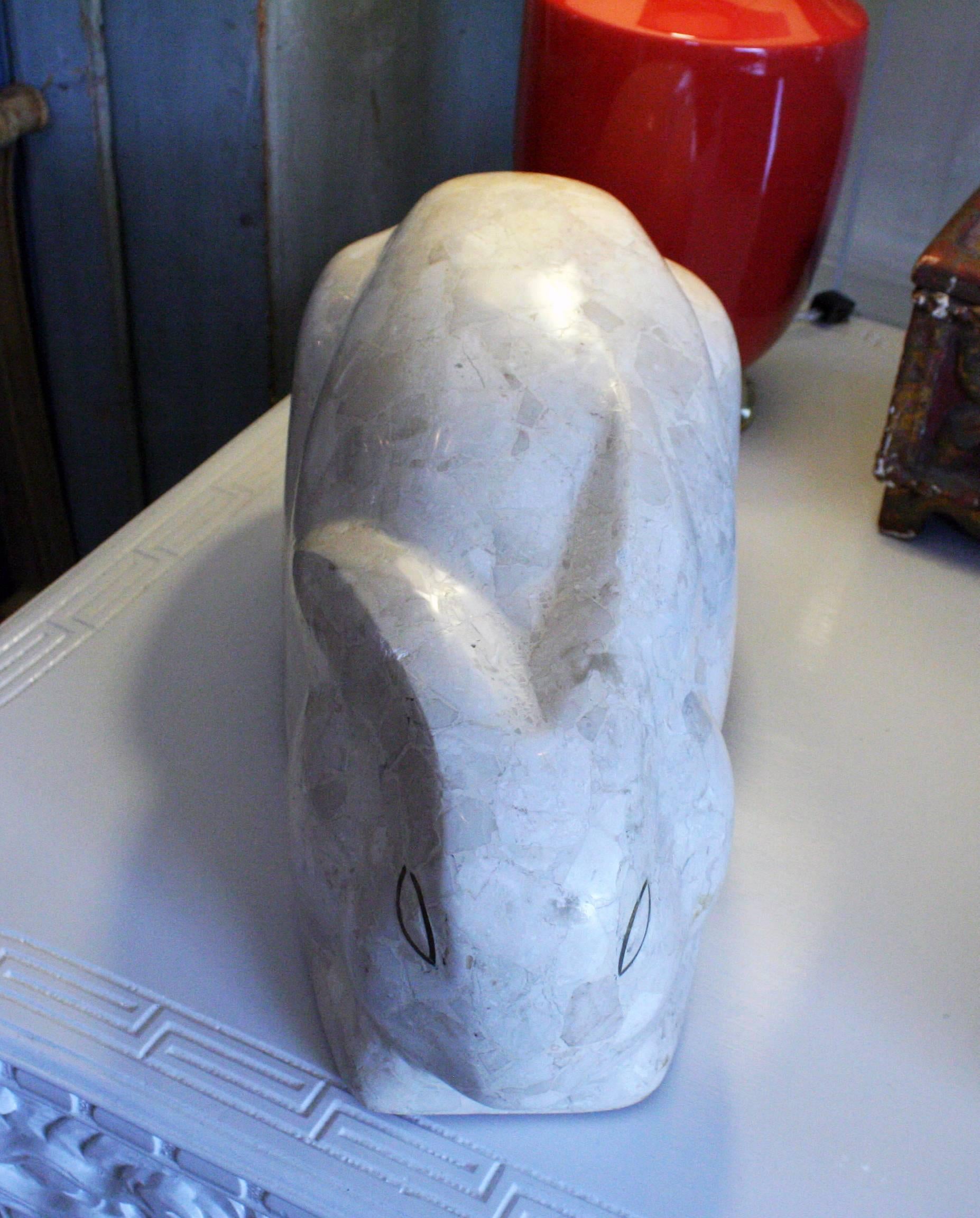 A mid-20th century polished stone mosaic rabbit sculpture.