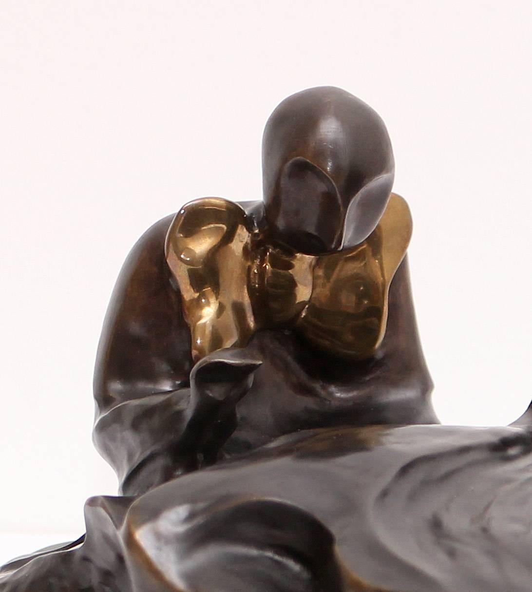 A flowing bronze sculpture of a pianist. He wears a gilt bow tie plays the grand piano. Signed 