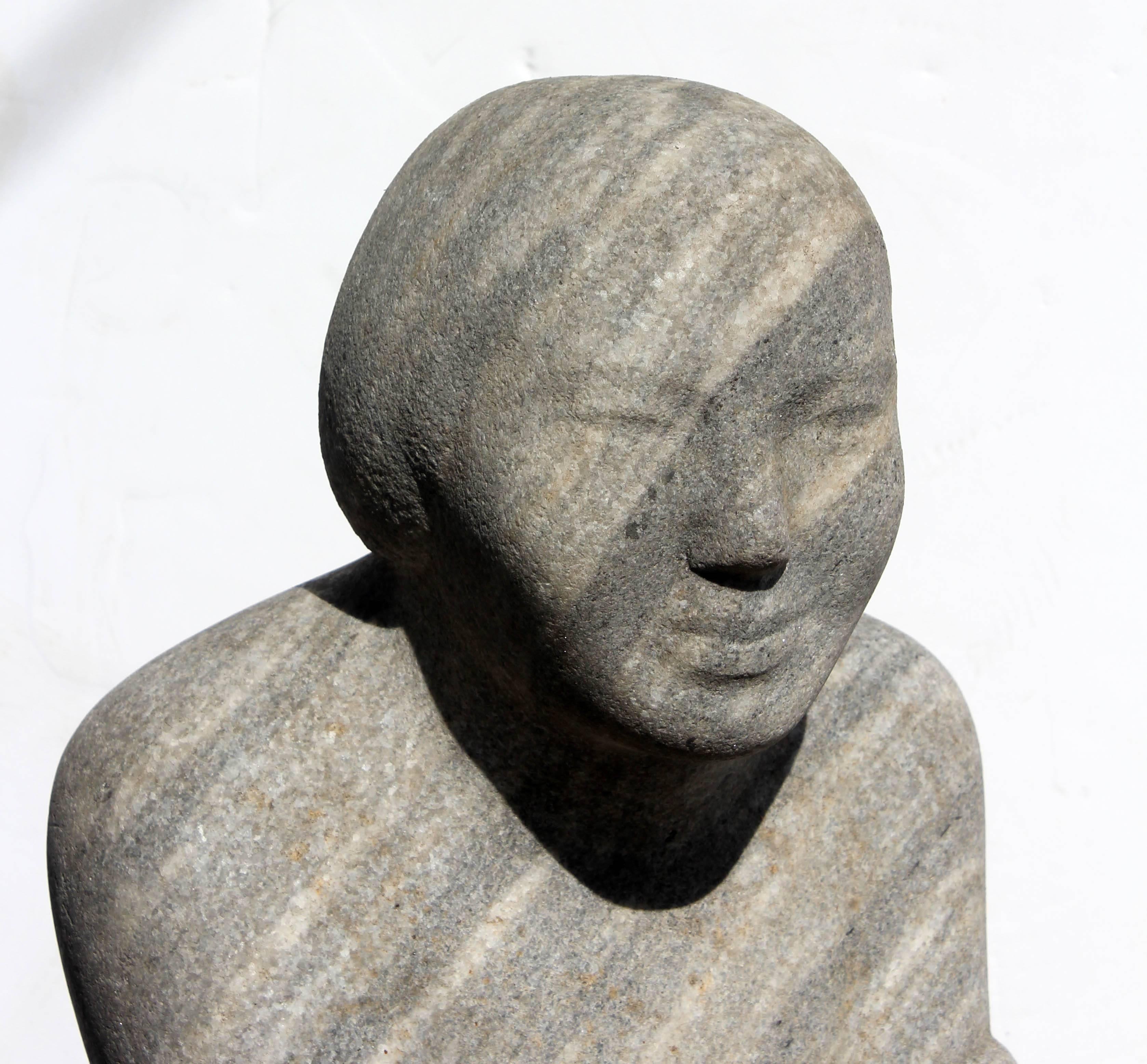 Modernist variegated carved granite sculpture of a young boy by Arnold Epp (Ohio 1914-1987). Two other works available.  Epp studied sculpture at the Ohio State University where he received a B.F.A. and M.A. and studied at the Art Students League in