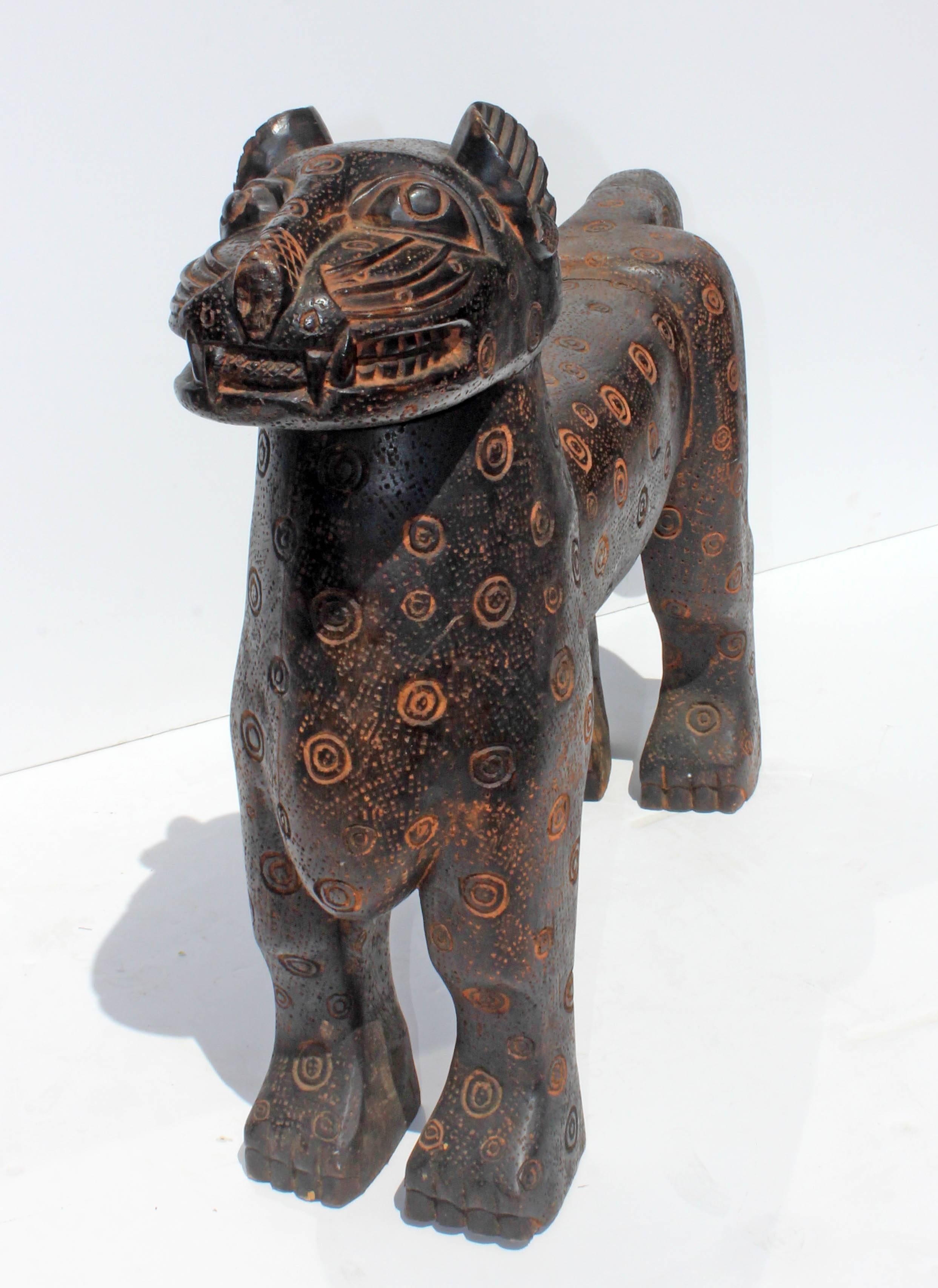 African Style Mid-Century carved hardwood leopard sculpture.