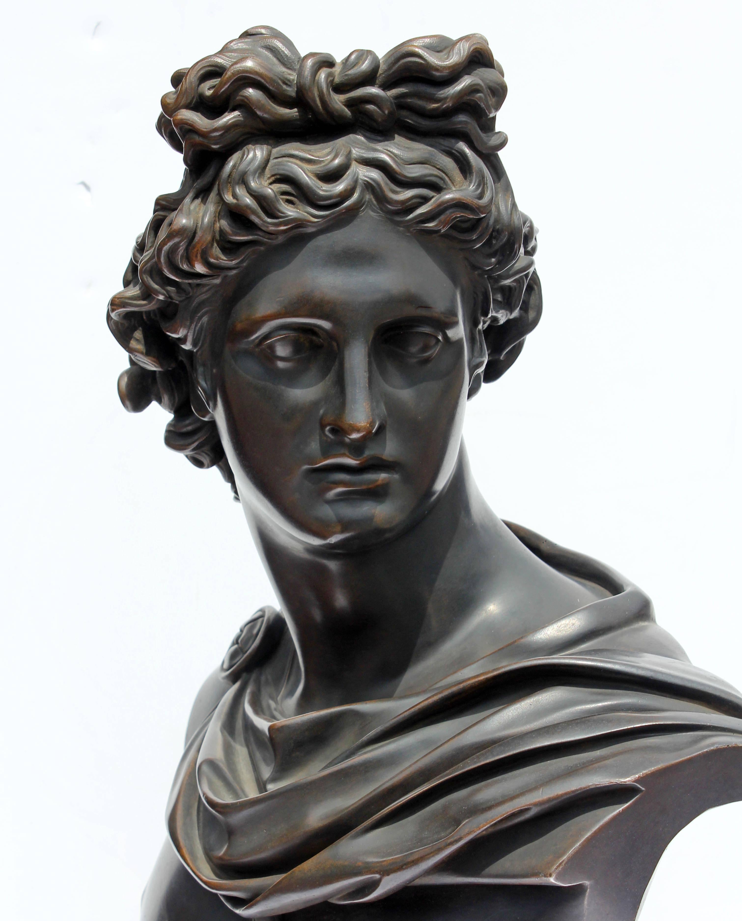 Large 19th century grand tour bronze sculpture, bust of Greek god Apollo. Patinated bronze on polished bronze base.