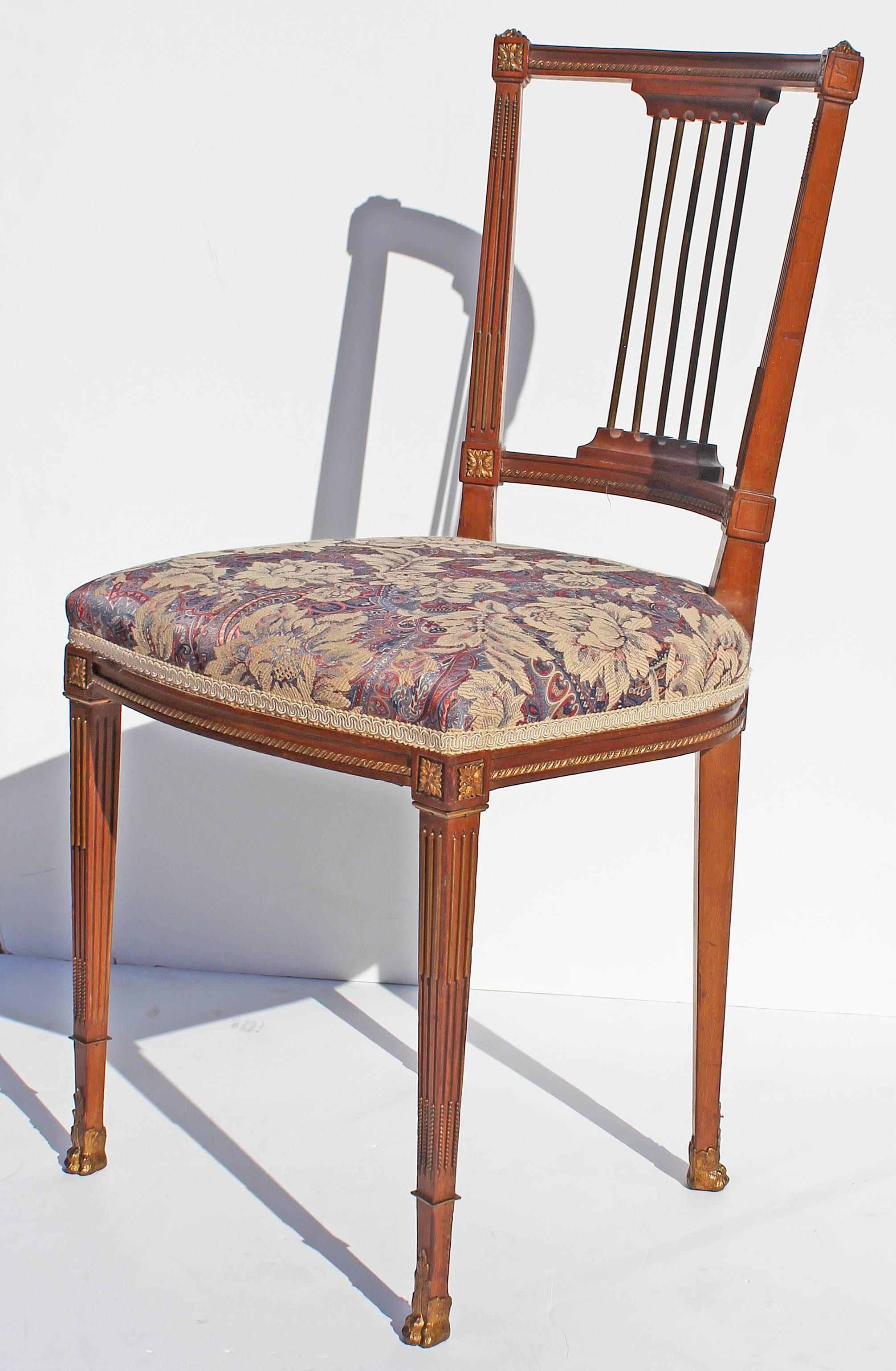 Petite French Louis XVI style boudoir side chair. Fruitwood with gilt mounts, late 19th century. See matching chair LU158525362273.