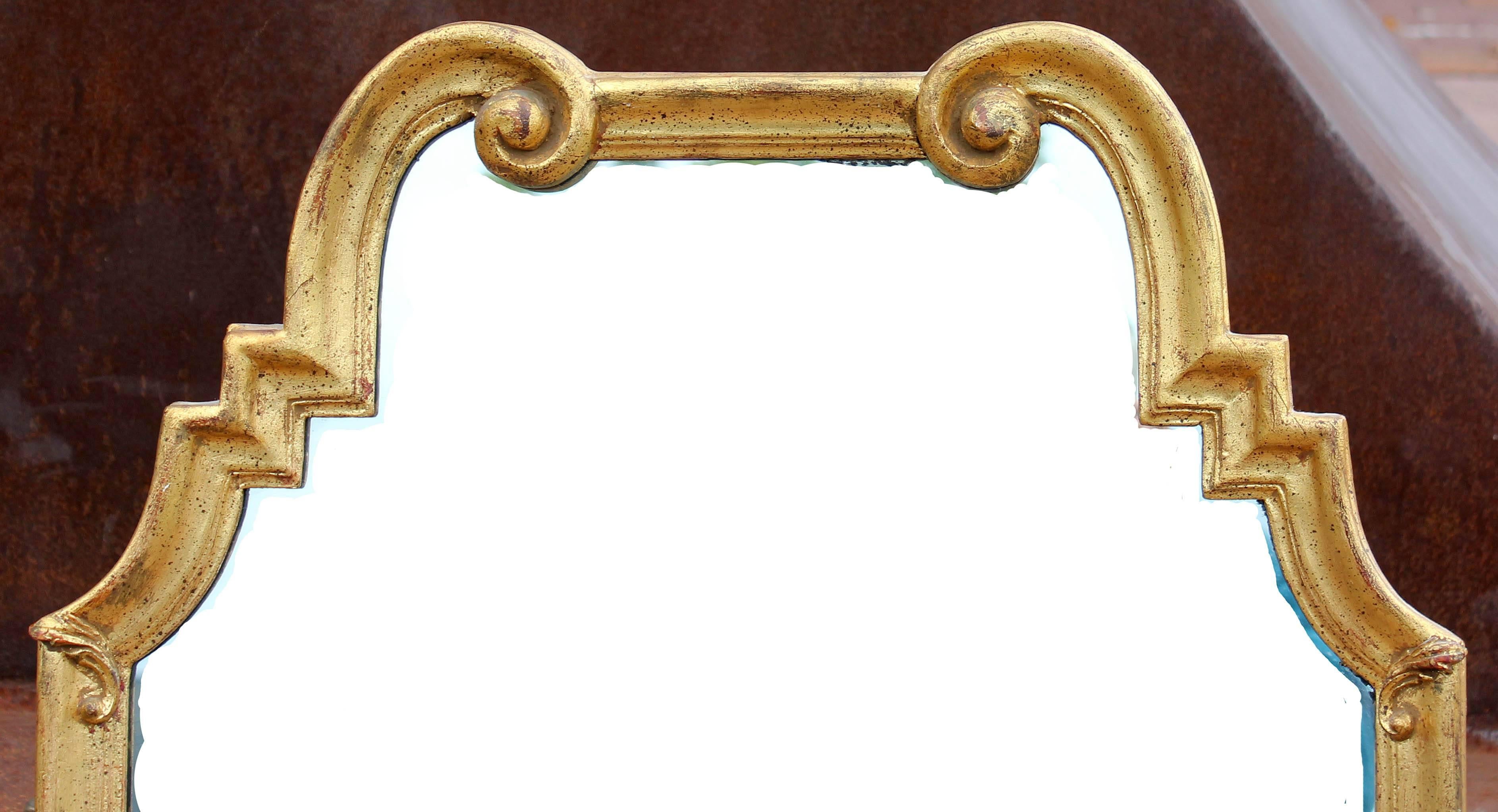 Hollywood Regency carved wood and gold leaf mirror by La Barge. 
LaBarge.