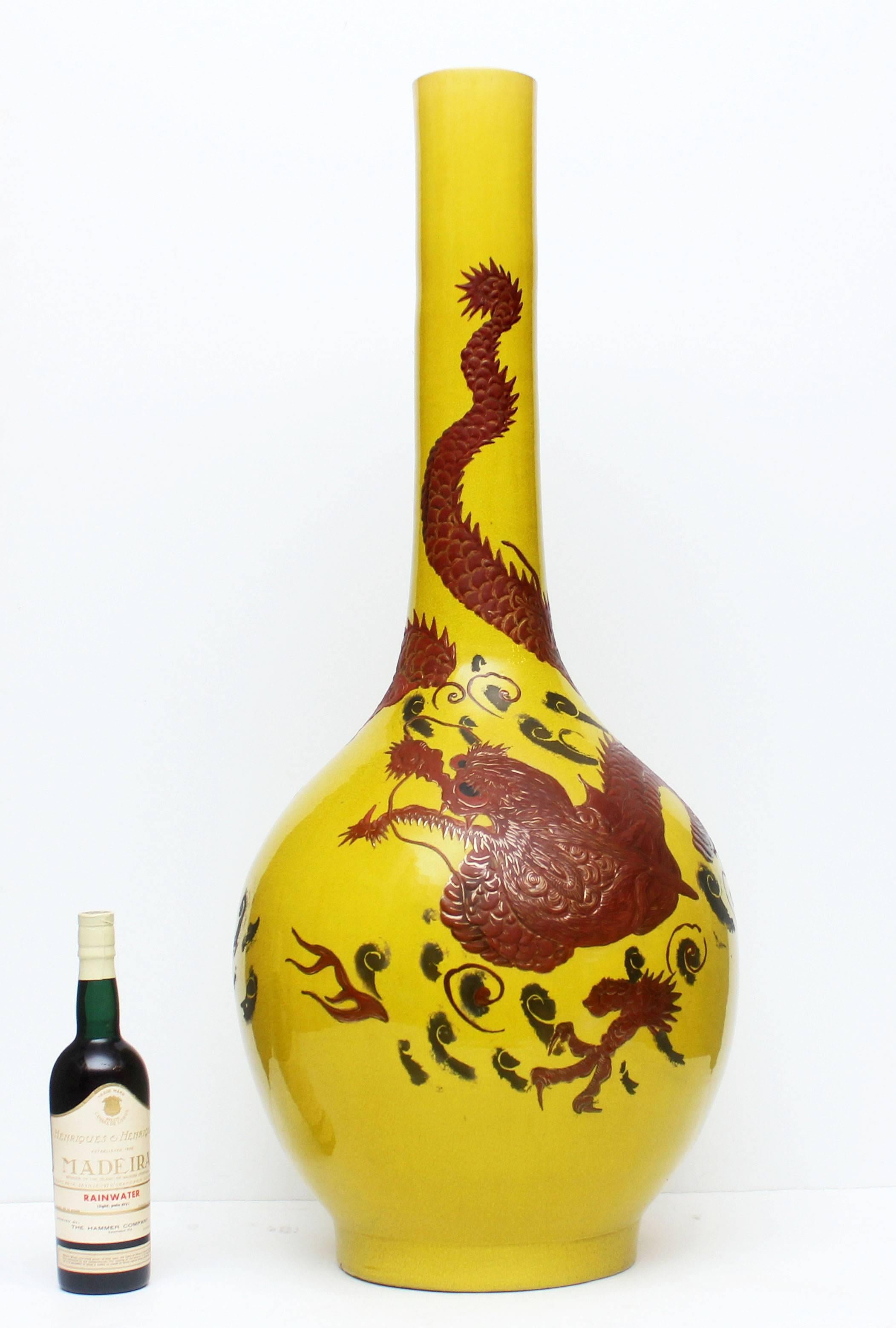 Imperial yellow palace vase decorated with oxblood colored dragon and old gilt highlights, circa 1920.
