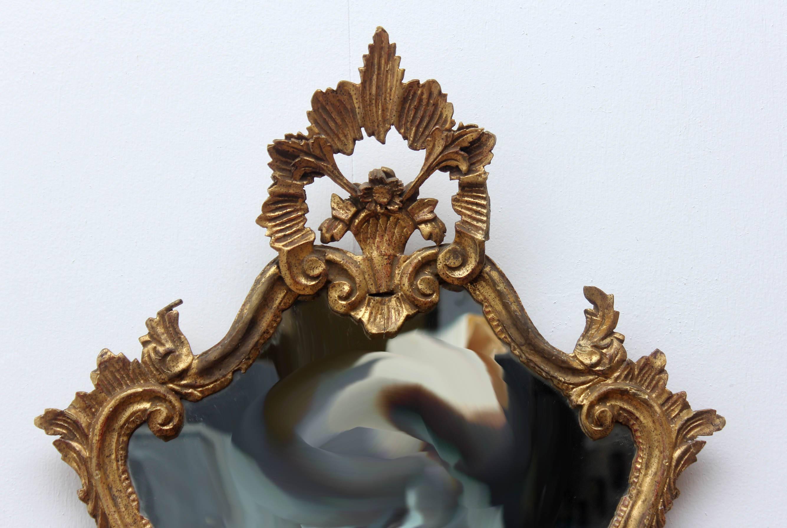 Antique Italian florentine carved and gilt mirror, circa 1920s.