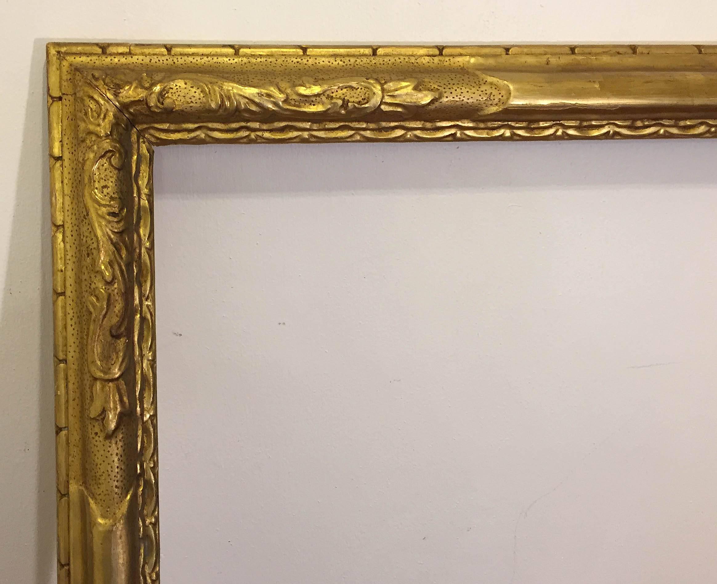 Arts and crafts carved and gold leafed frame by Brandywine frame maker Francis Coll. Signed "F. Coll". Dated 1925. Coll, a frame maker who worked in Wilmington, Delaware, was the subject of a significant exhibition of his carvings at the