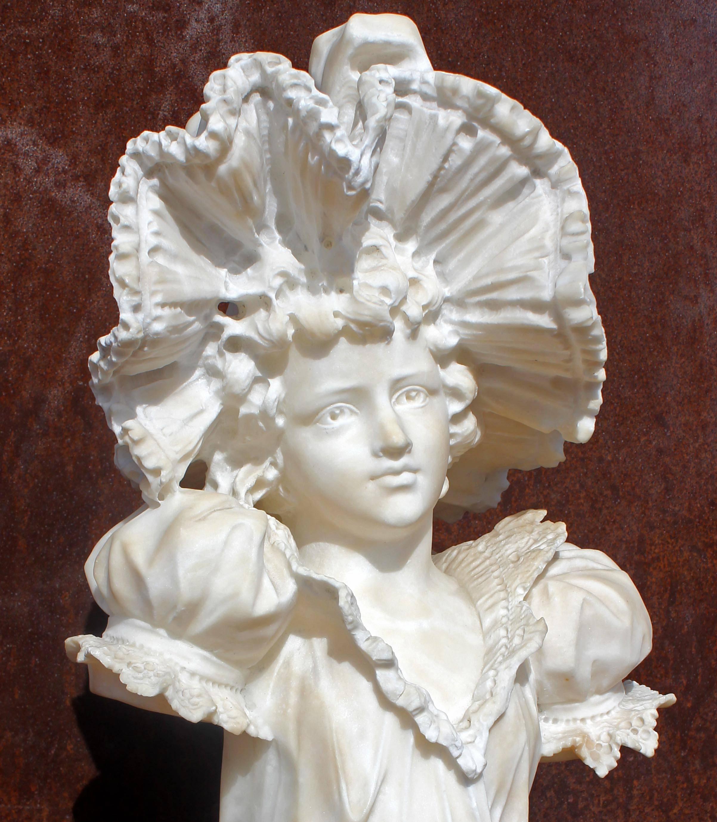 Antique Italian carved marble bust of a woman in a lace hat, 19th century.